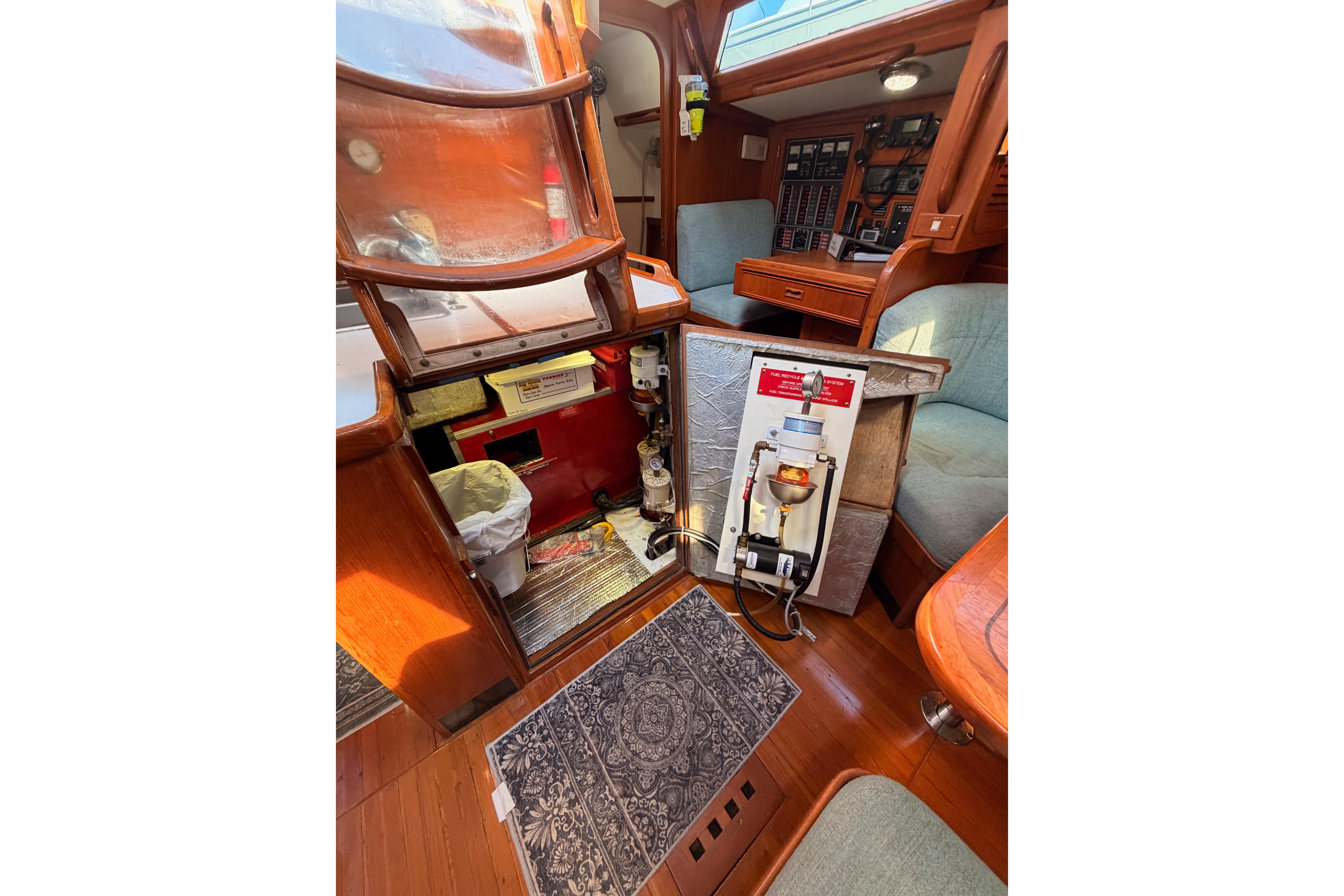 Interior of a 1991 Hylas 51 yacht showing engine compartment and control panels.