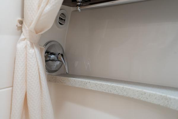 2016 Regal 28 Express boat interior shower with curtain and faucet.