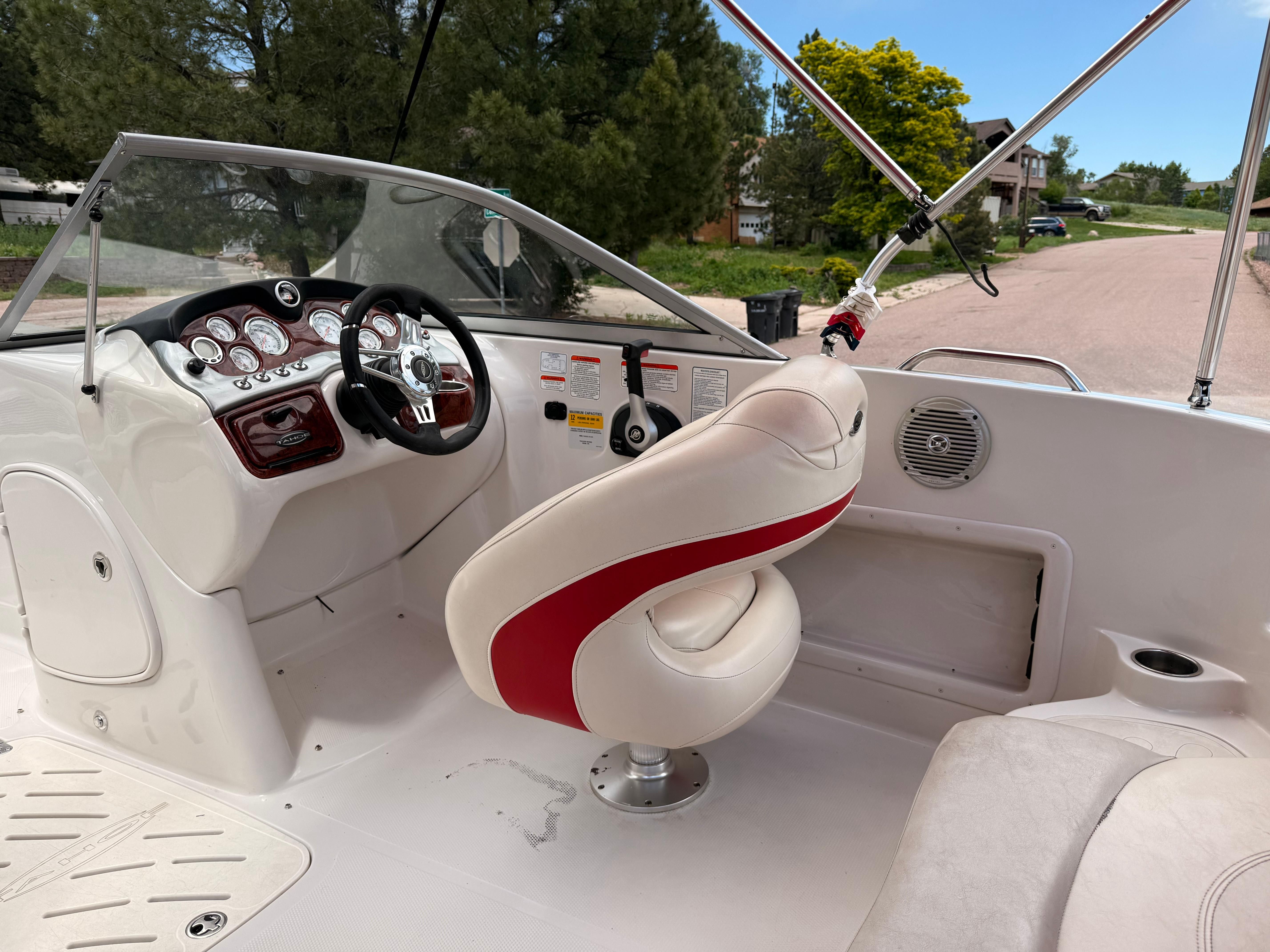 Interior of a 2011 Tahoe 216 WT boat with steering console.