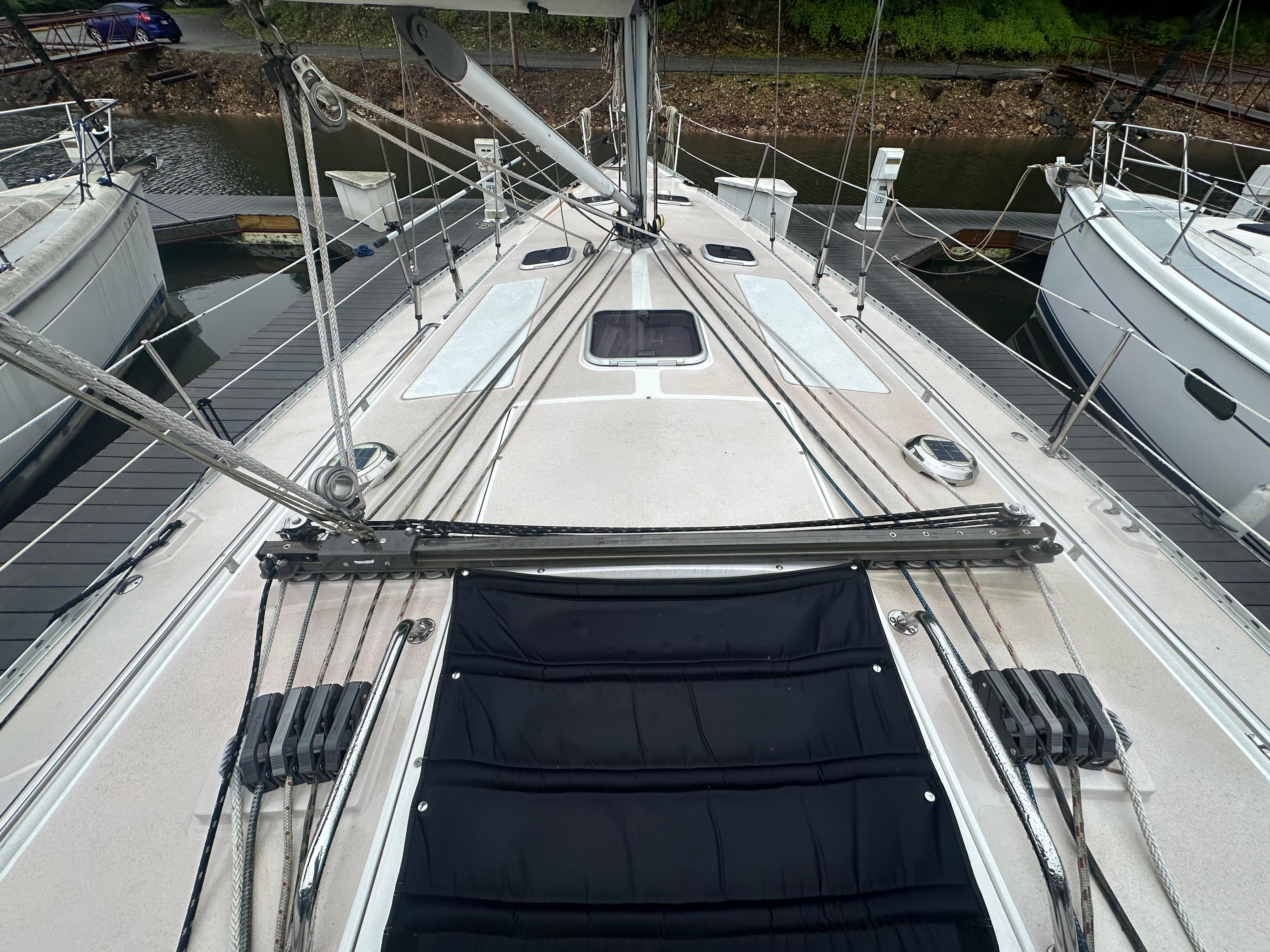 Deck view of a 1998 Catalina 400 sailboat, showcasing rigging and hatch details.