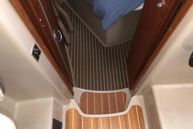 Interior view of 2013 Ranger Tugs R-29 S boat with wooden flooring.