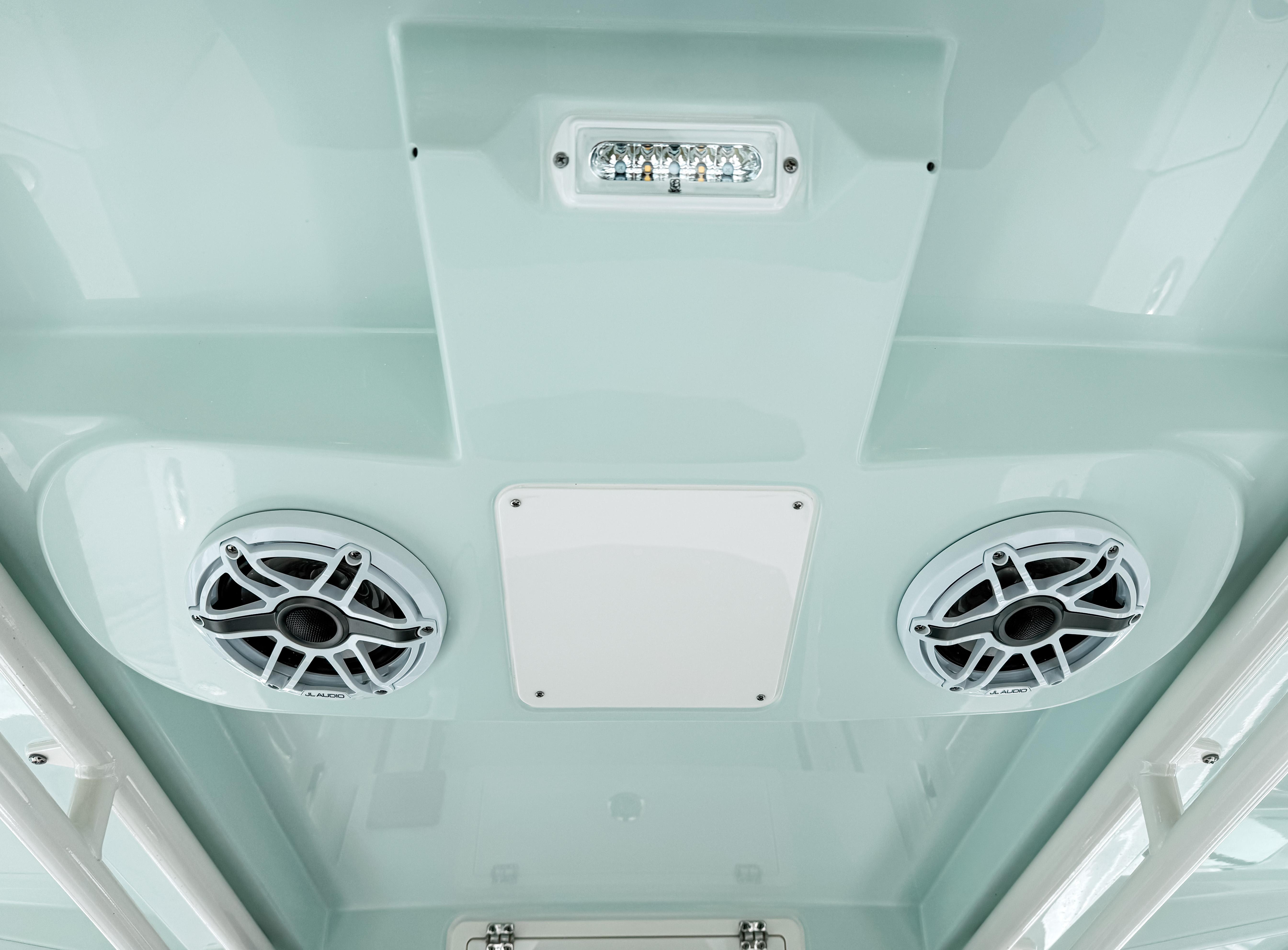 Ceiling view of 2025 Pursuit S 268 Sport boat with speakers and light fixture.