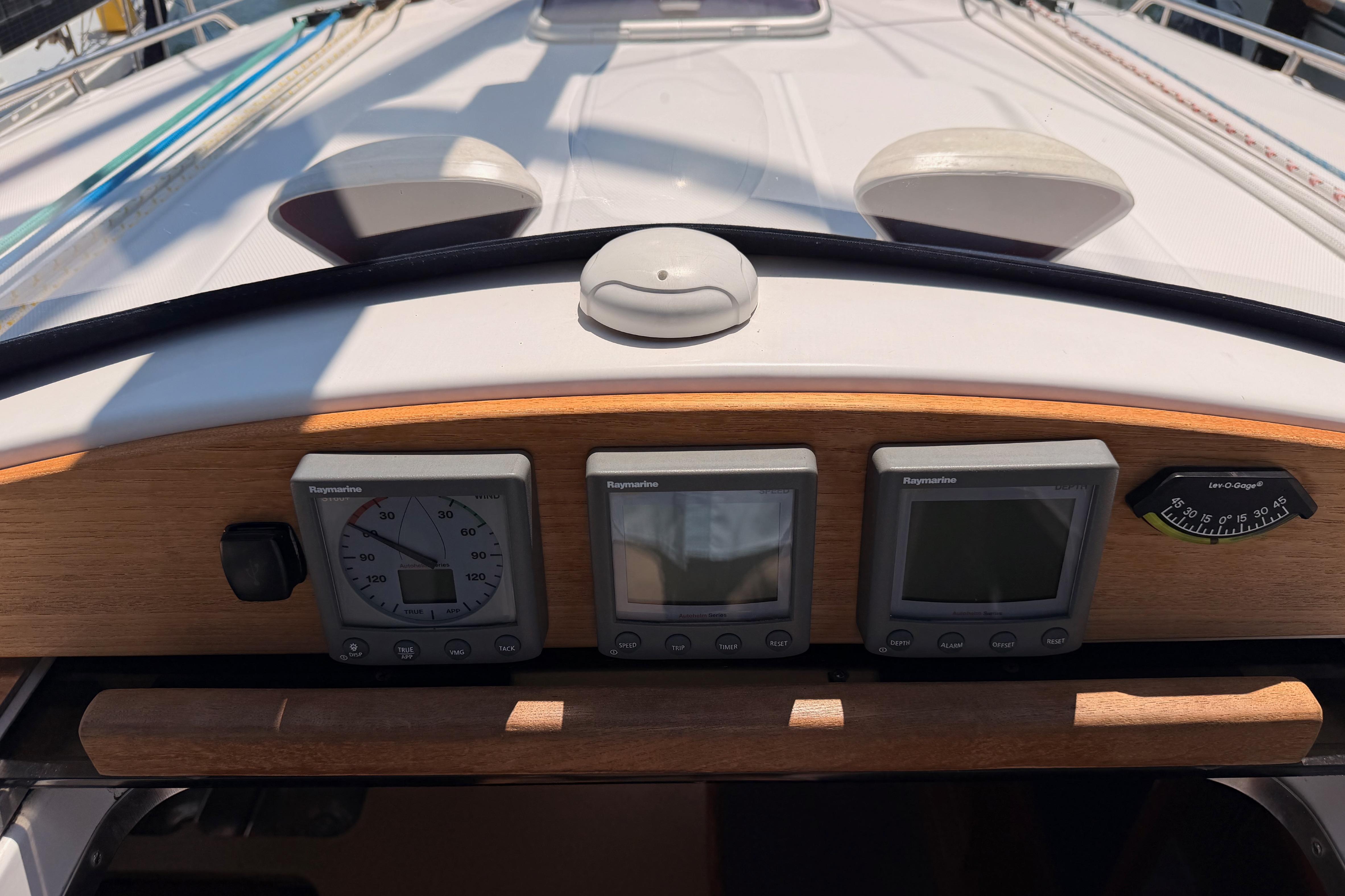 Control panel of 2008 Hunter 45 Deck Salon sailboat with Raymarine instruments.