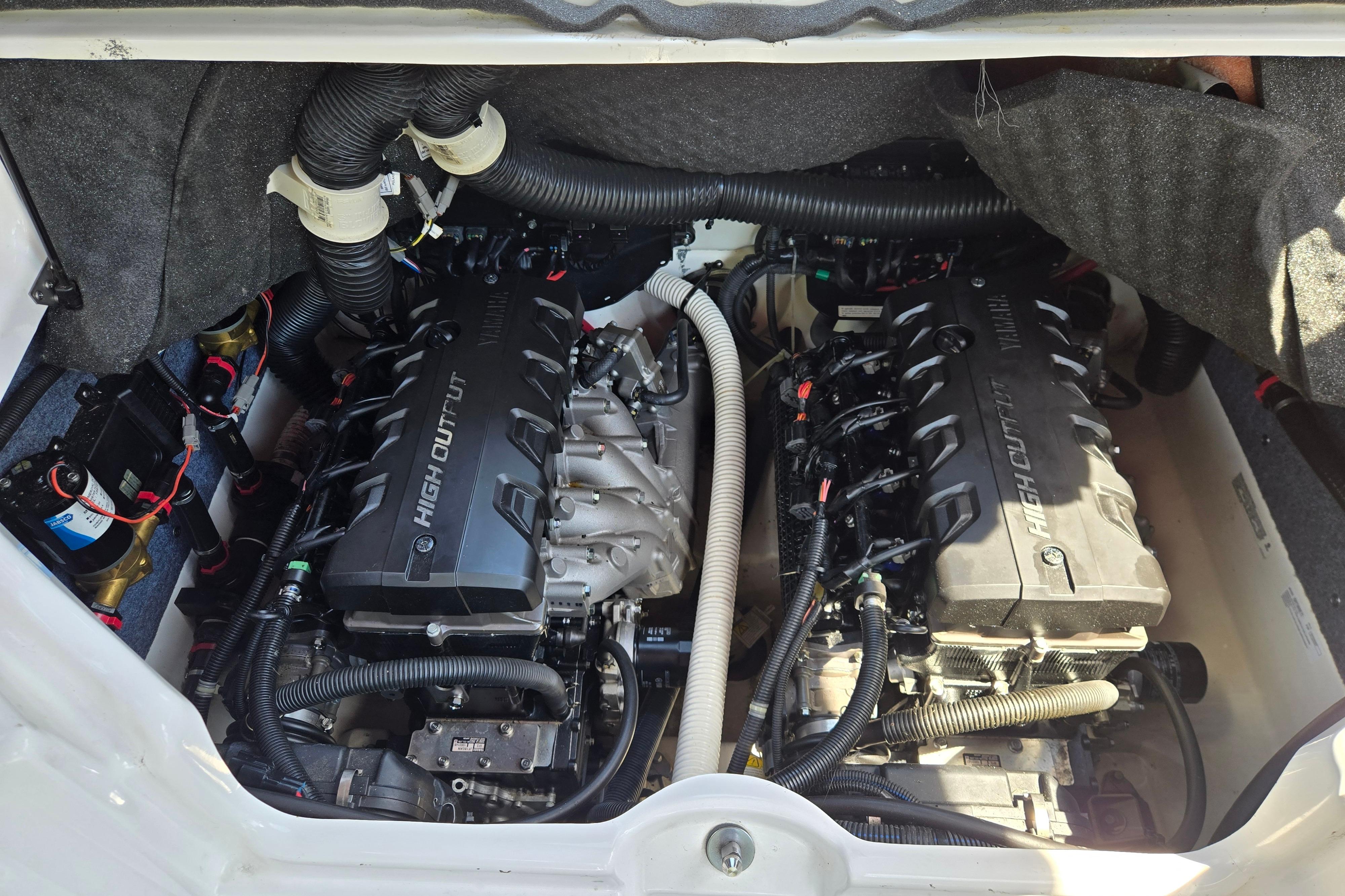 Engine compartment of a 2018 Yamaha Boats 242X, featuring dual high-output engines.
