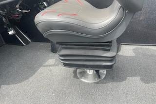 2023 Nitro ZV19 Sport boat seat with adjustable pedestal on carpeted floor.