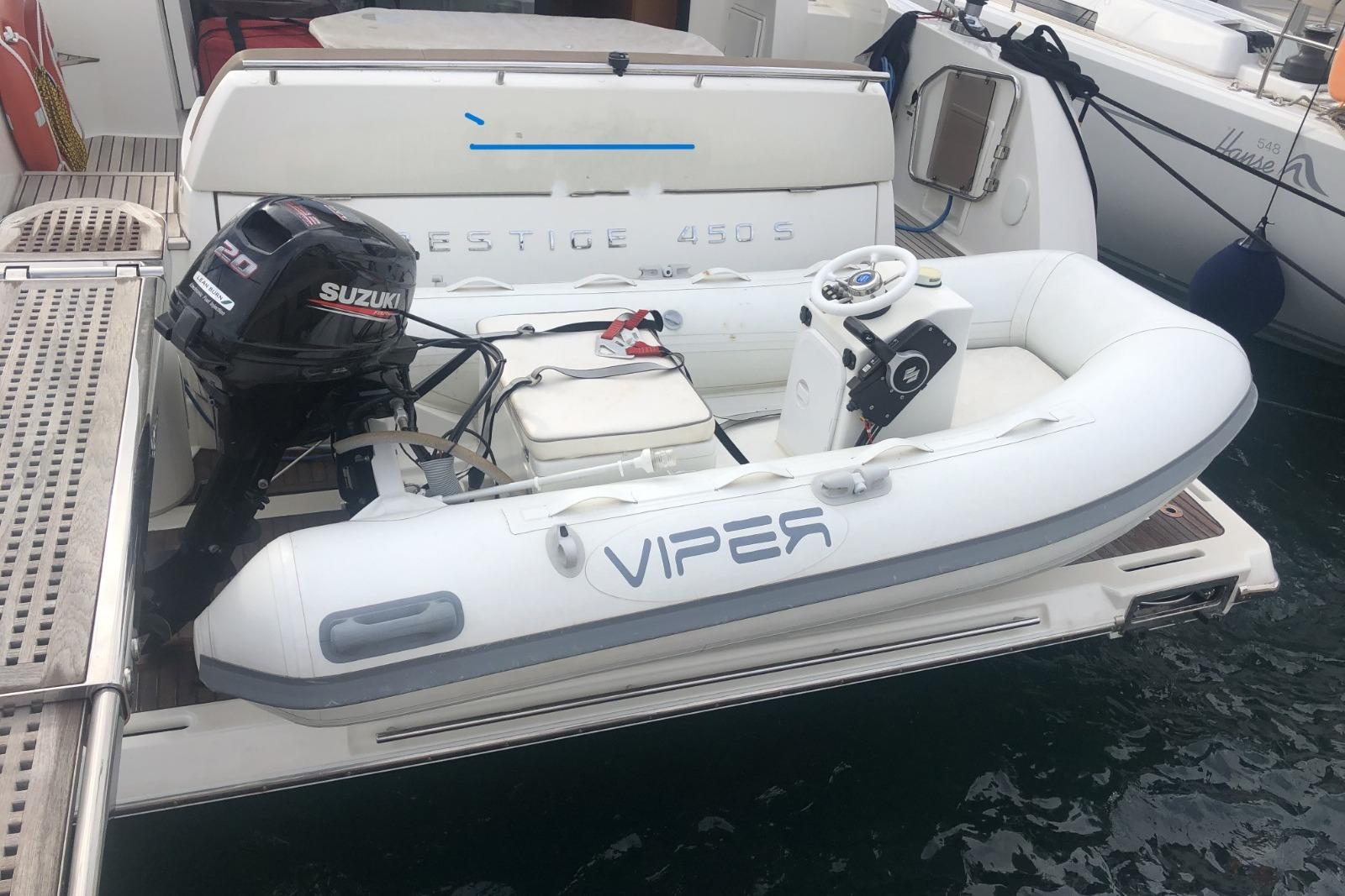 Inflatable boat with Suzuki motor on 2013 Prestige 450S yacht.