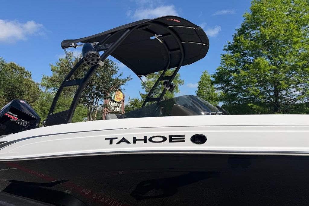 2026 Tahoe T21 boat with sleek design, black and white finish, and outdoor setting.