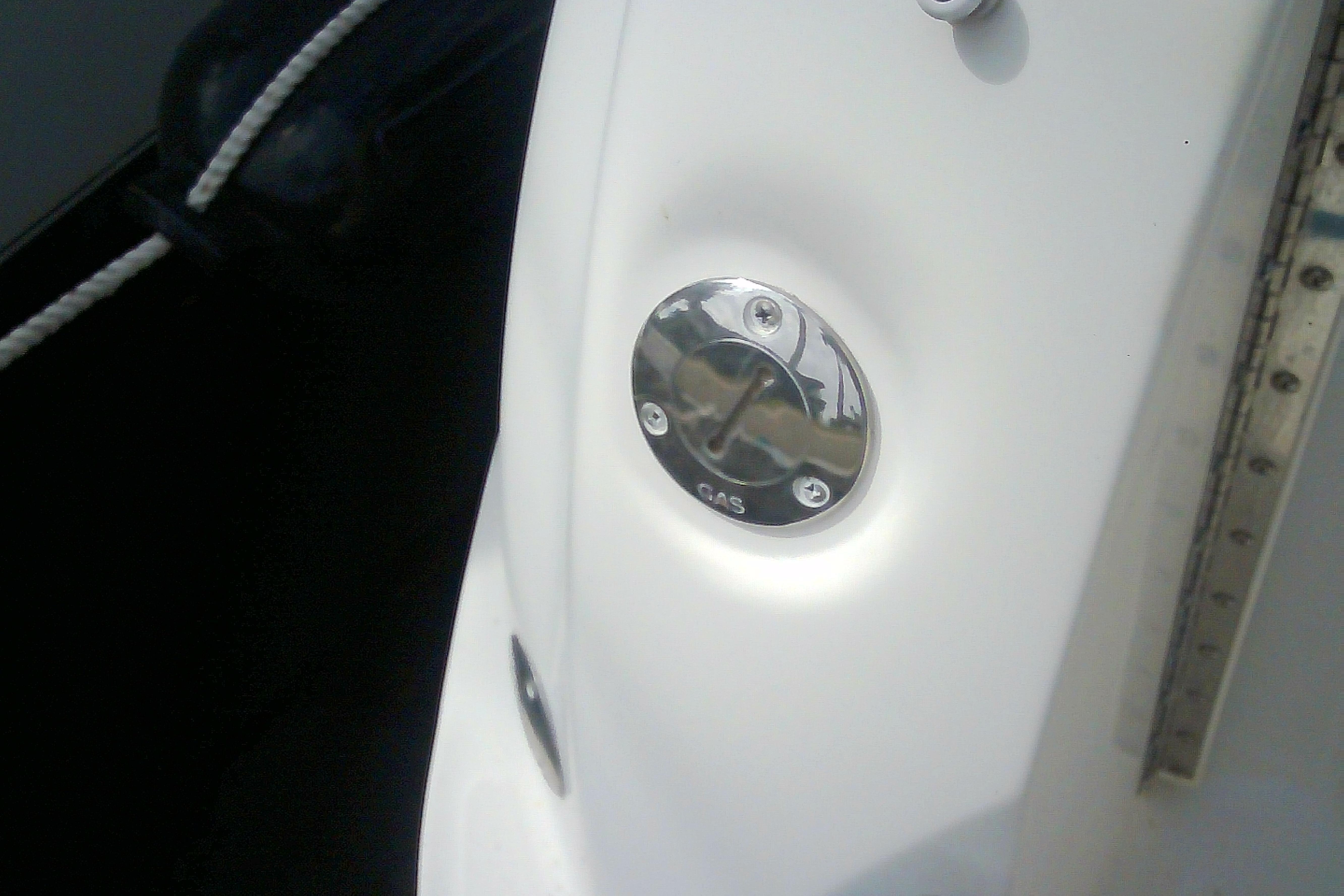Gas cap on 2005 Sea Ray 300 Sundancer boat, close-up view.