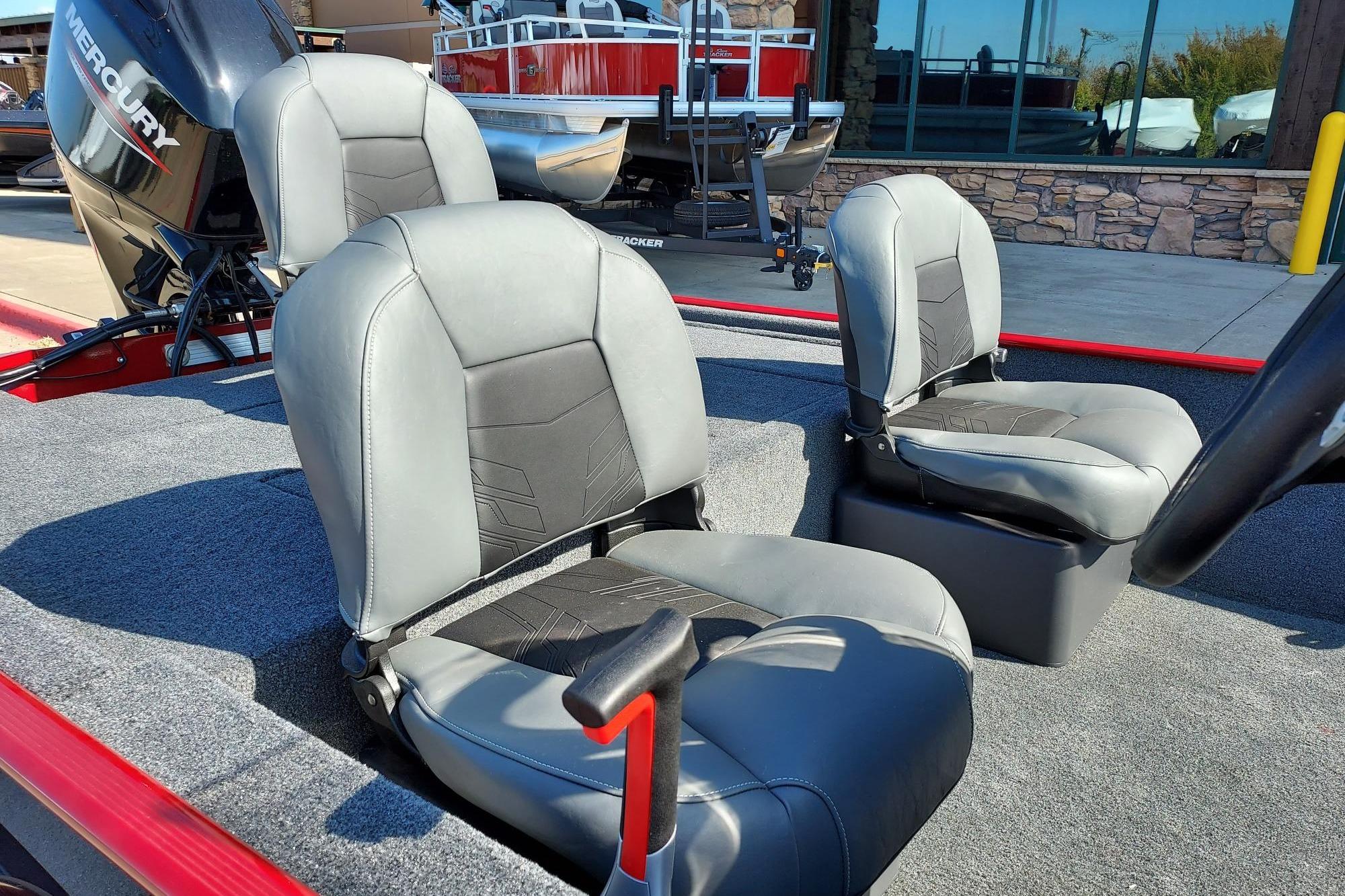 2026 Tracker Bass Tracker Classic XL boat seats with Mercury engine in showroom.