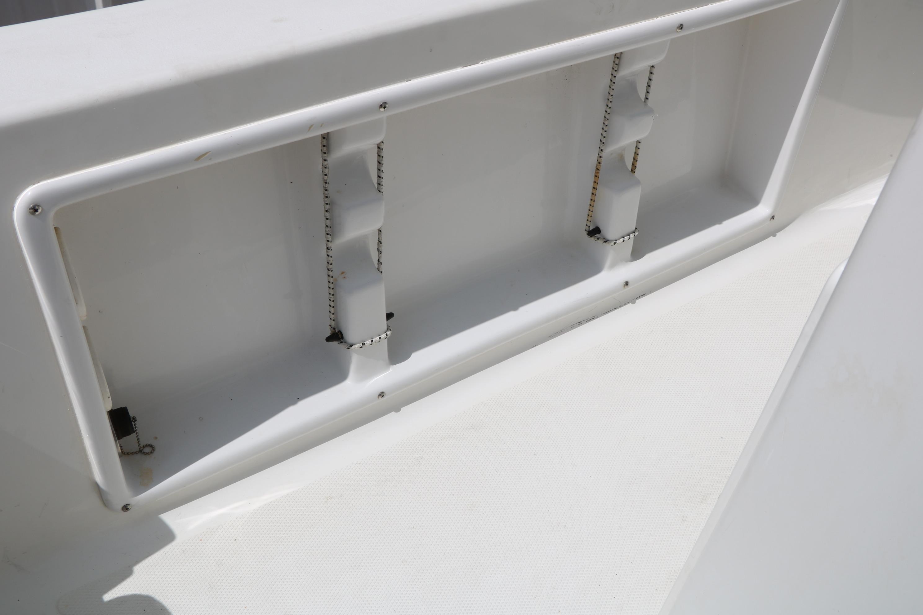 2015 Sea Hunt BX 22 BR boat interior storage compartment detail.