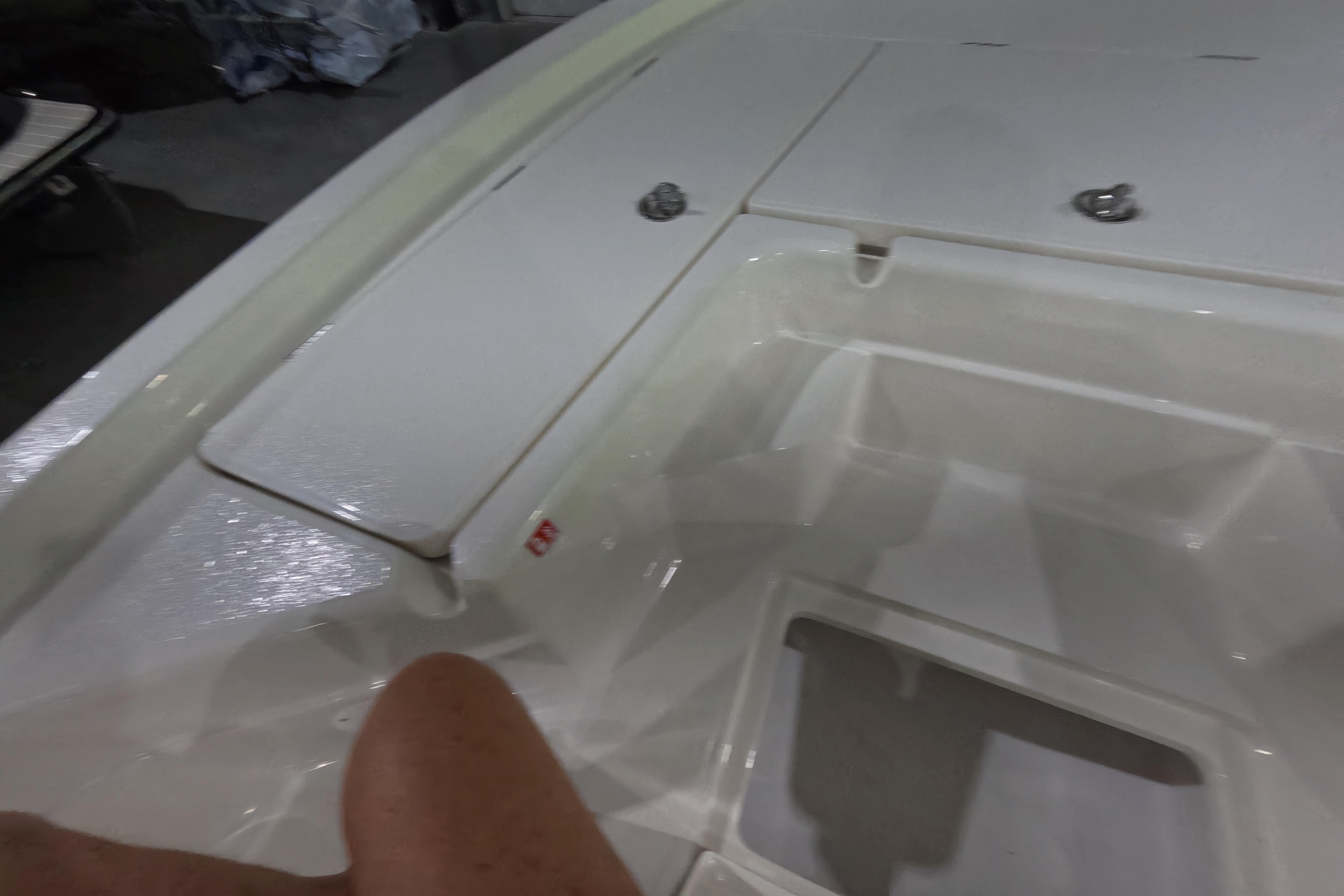 Interior view of 2026 Skeeter SX221 boat, showcasing storage compartments.