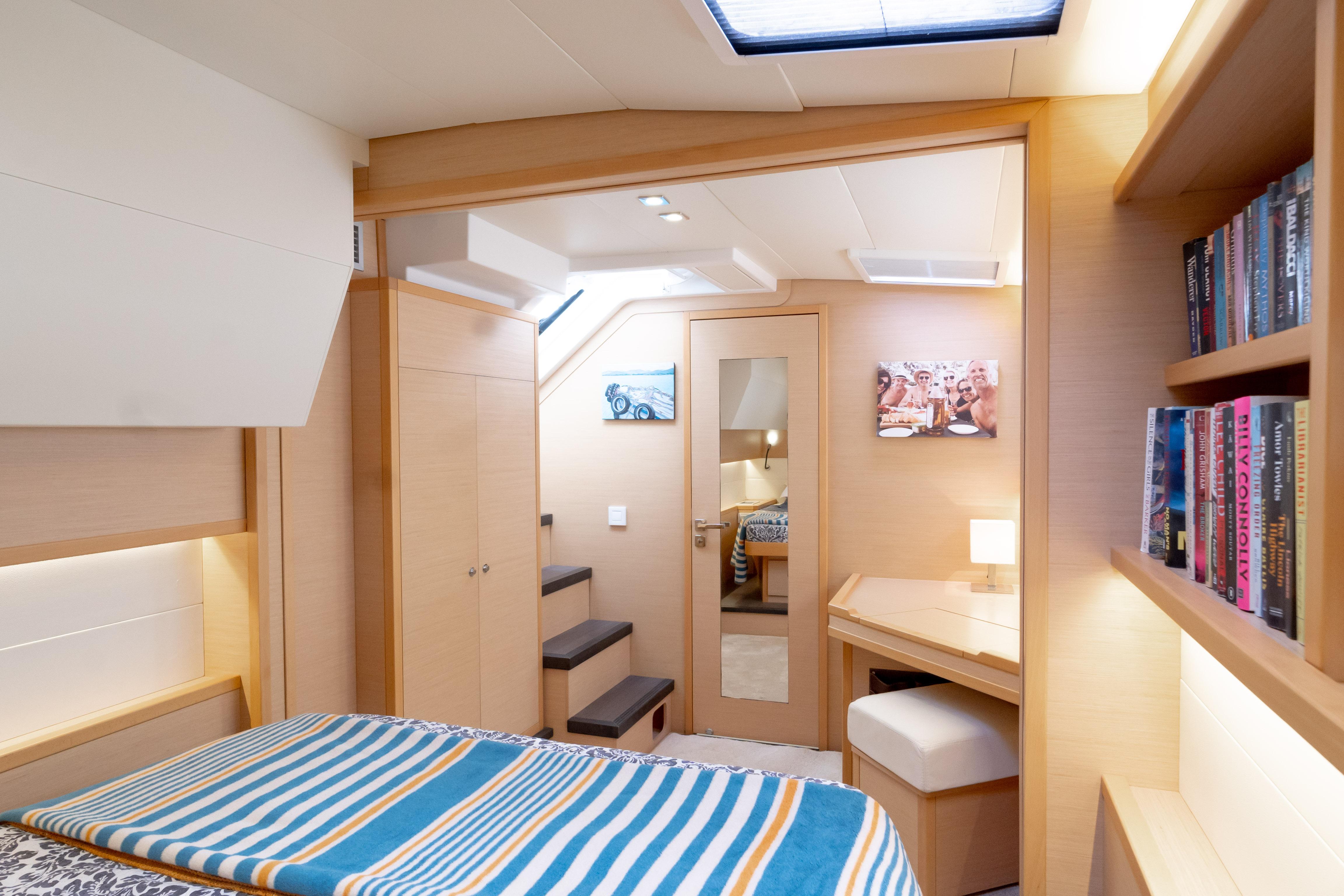 Luxurious interior of 2015 Lagoon 52 F yacht cabin with modern decor and cozy furnishings.