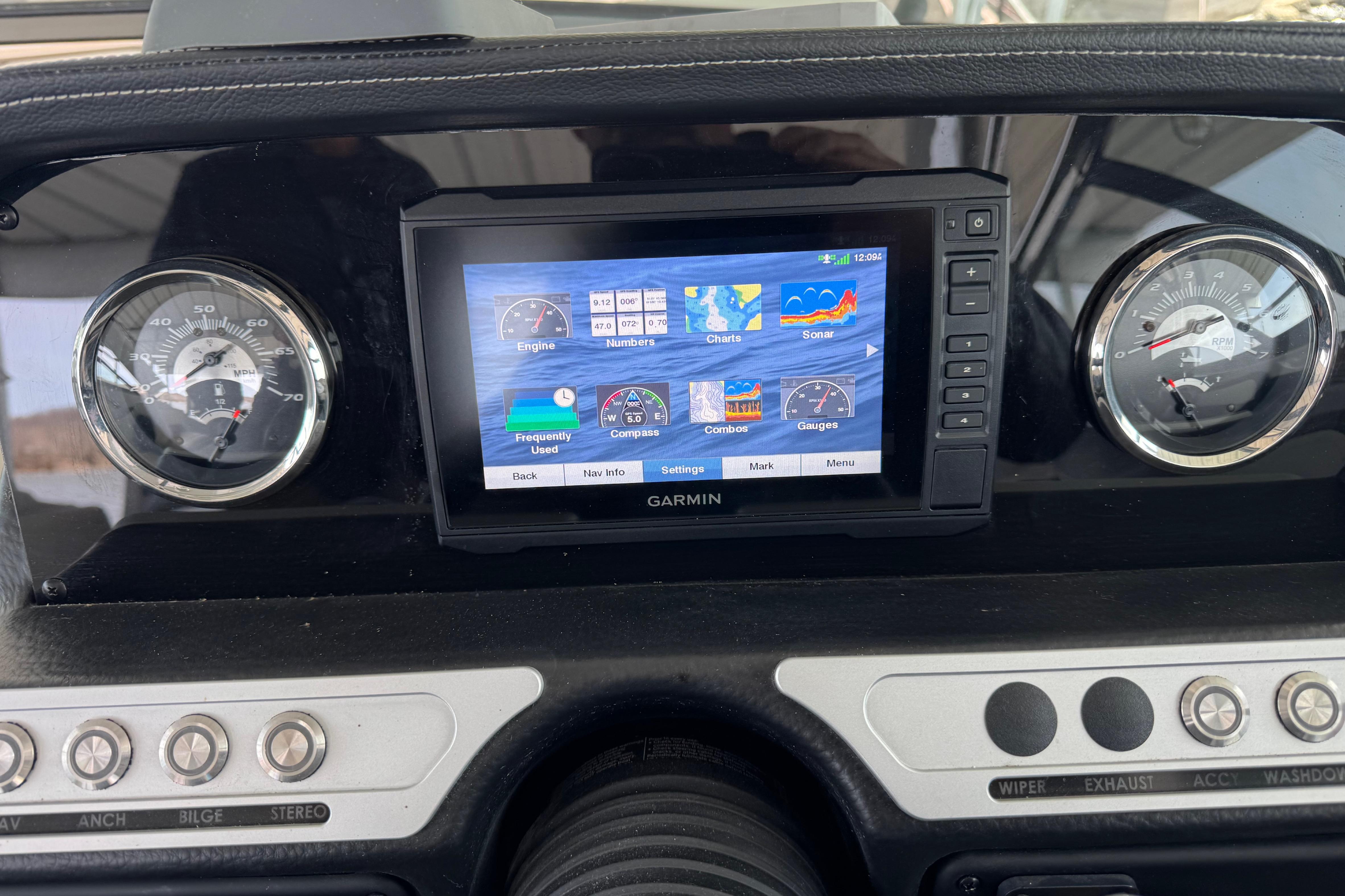 Dashboard of 2022 Crownline 265 SS with Garmin display and gauges.