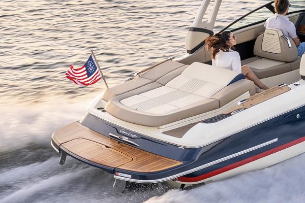 Manufacturer Provided Image: 2025 Chris-Craft Sportster 25 boat cruising with American flag.