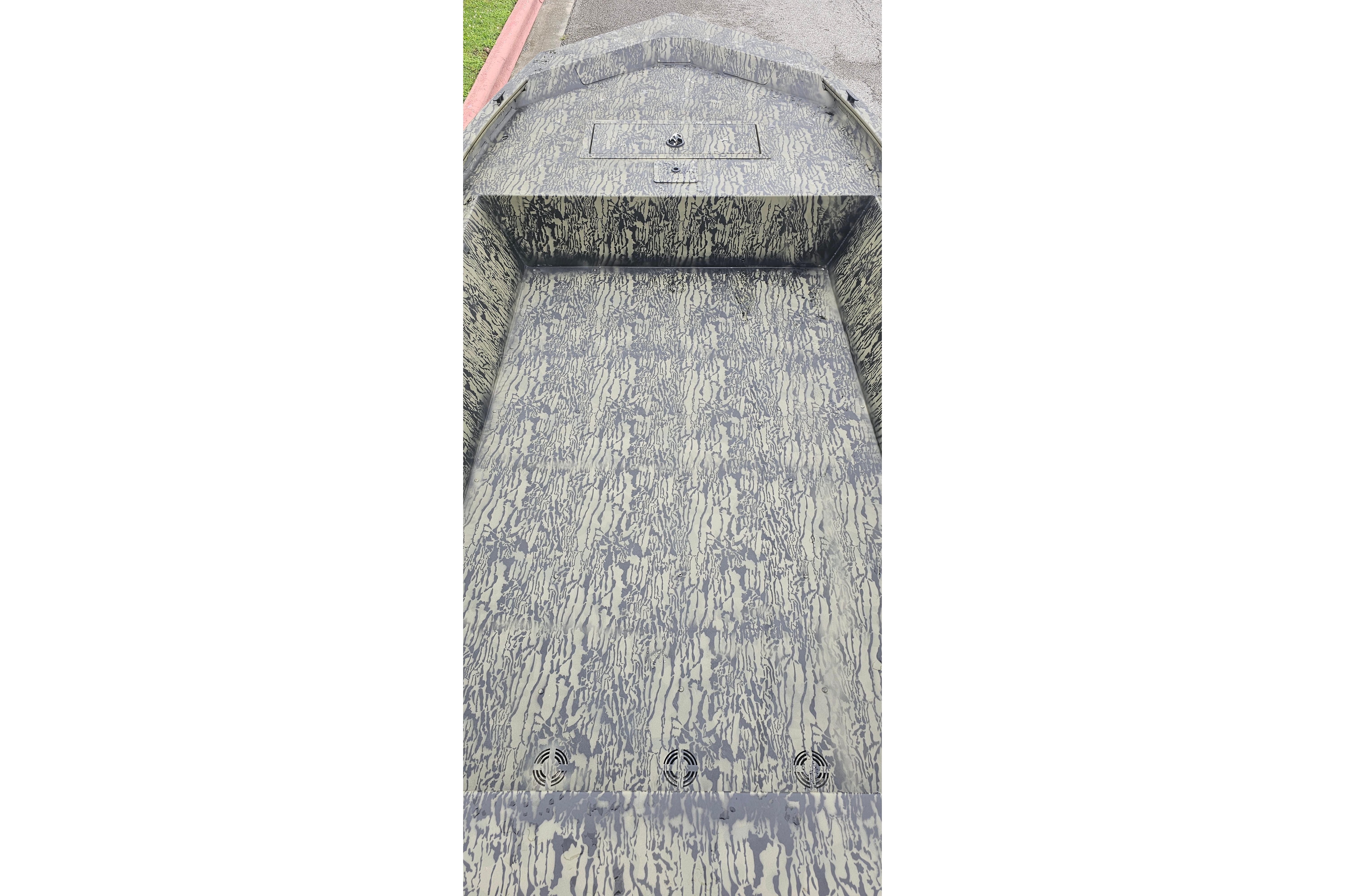 2026 Tracker Grizzly 1648 Utility boat interior with camouflage pattern.