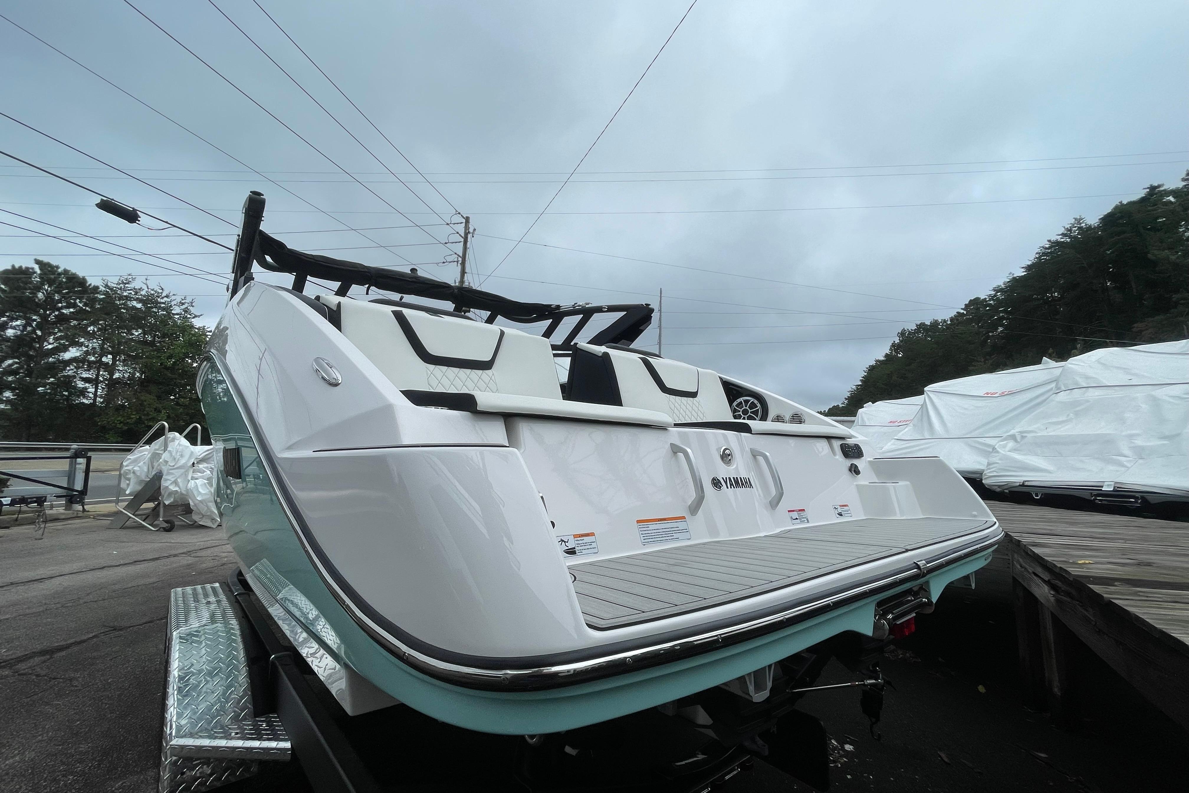 2026 Yamaha Boats 222S, sleek design, rear view, parked outdoors on a trailer.