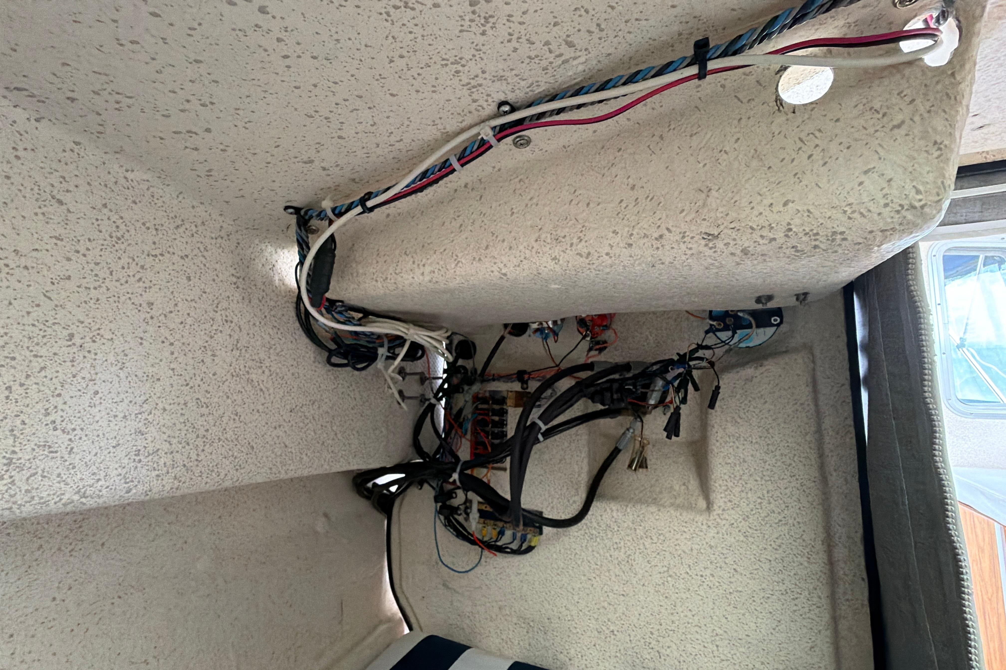 Interior wiring of a 1989 C-Dory 22' Angler boat, showcasing electrical components.