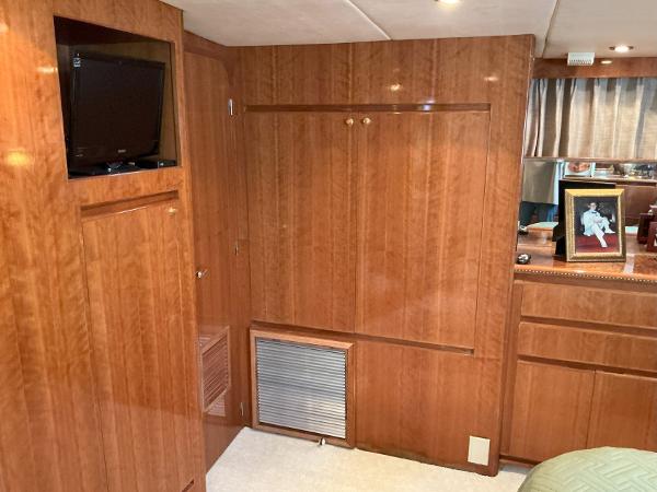 Interior of 2000 Novatec Islander 55 yacht with wood paneling and built-in TV.