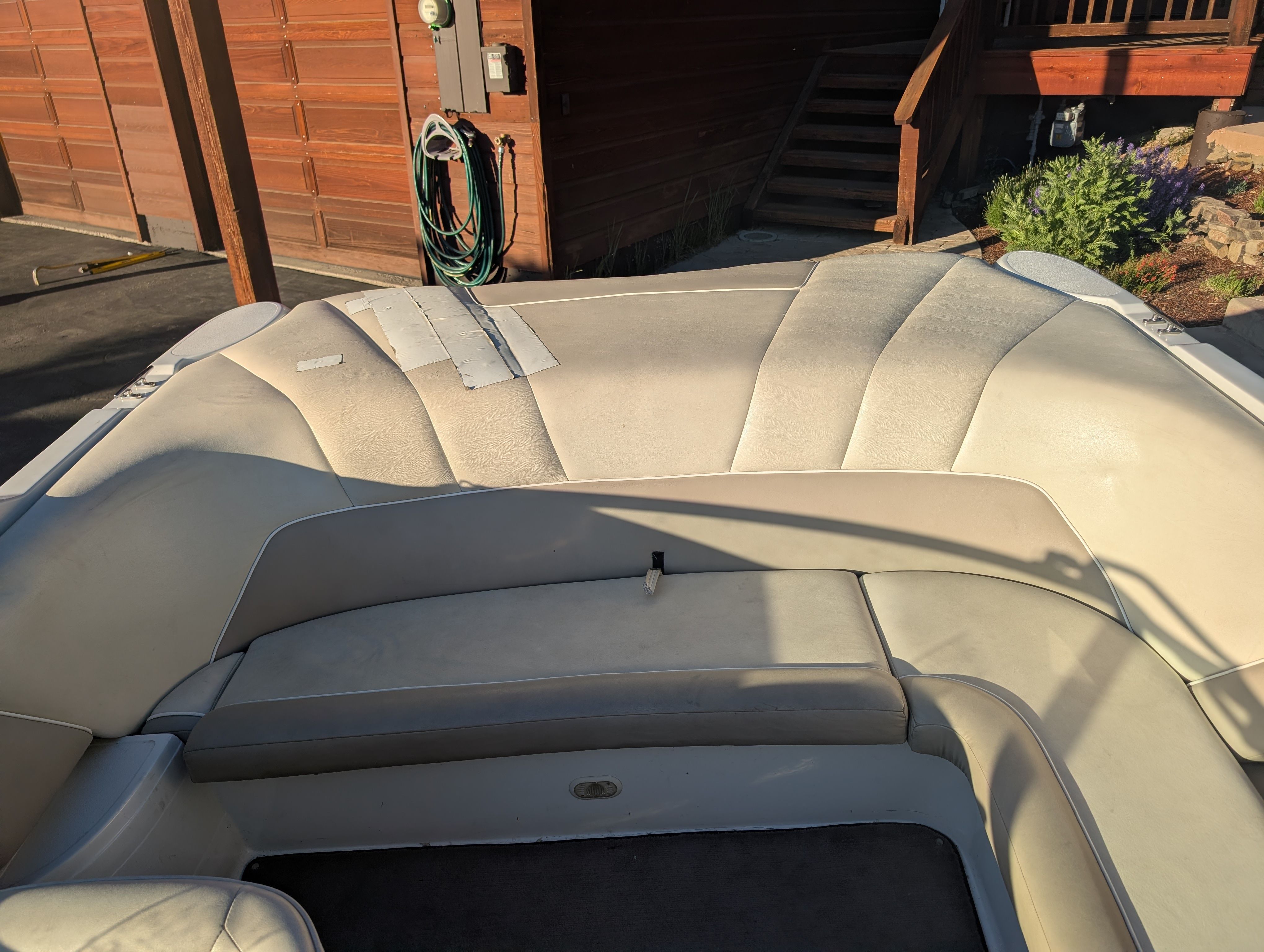 The image shows the cockpit of a 1997 Cobalt 190 boat with beige upholstery.