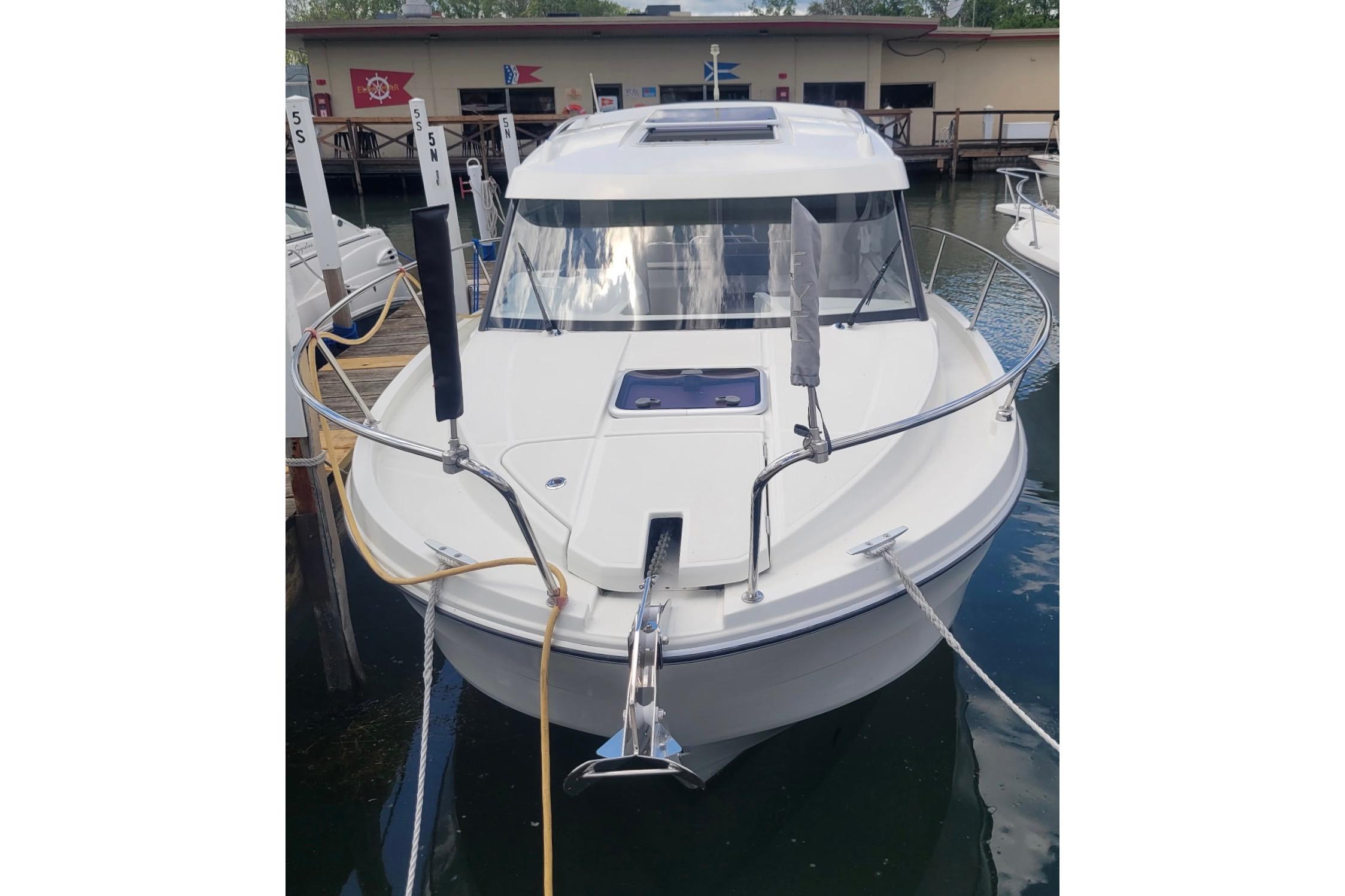 2019 Beneteau Antares 23 boat docked, showcasing sleek design and modern features.