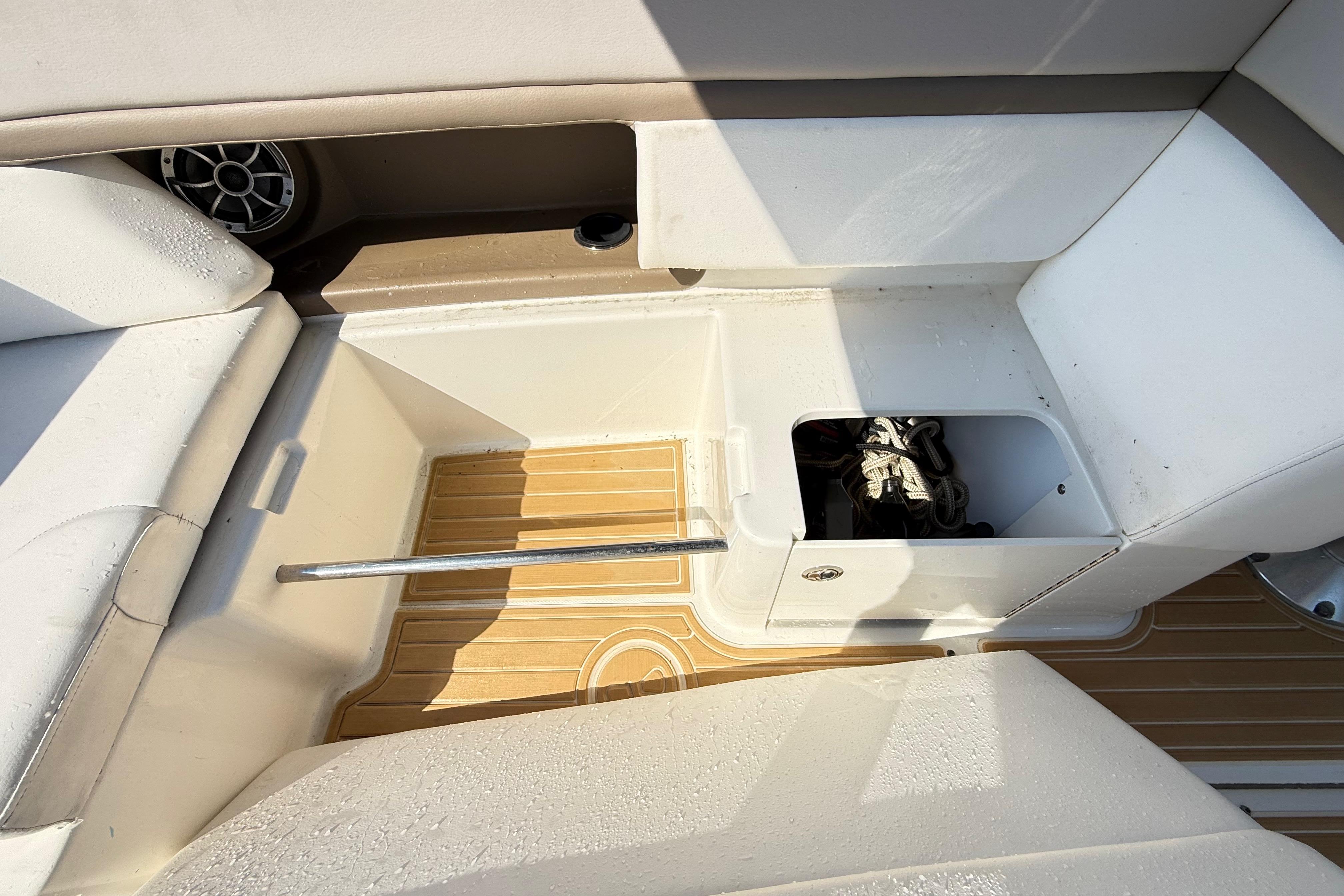 2011 Sea Ray 270 SLX boat interior with storage compartment and seating.