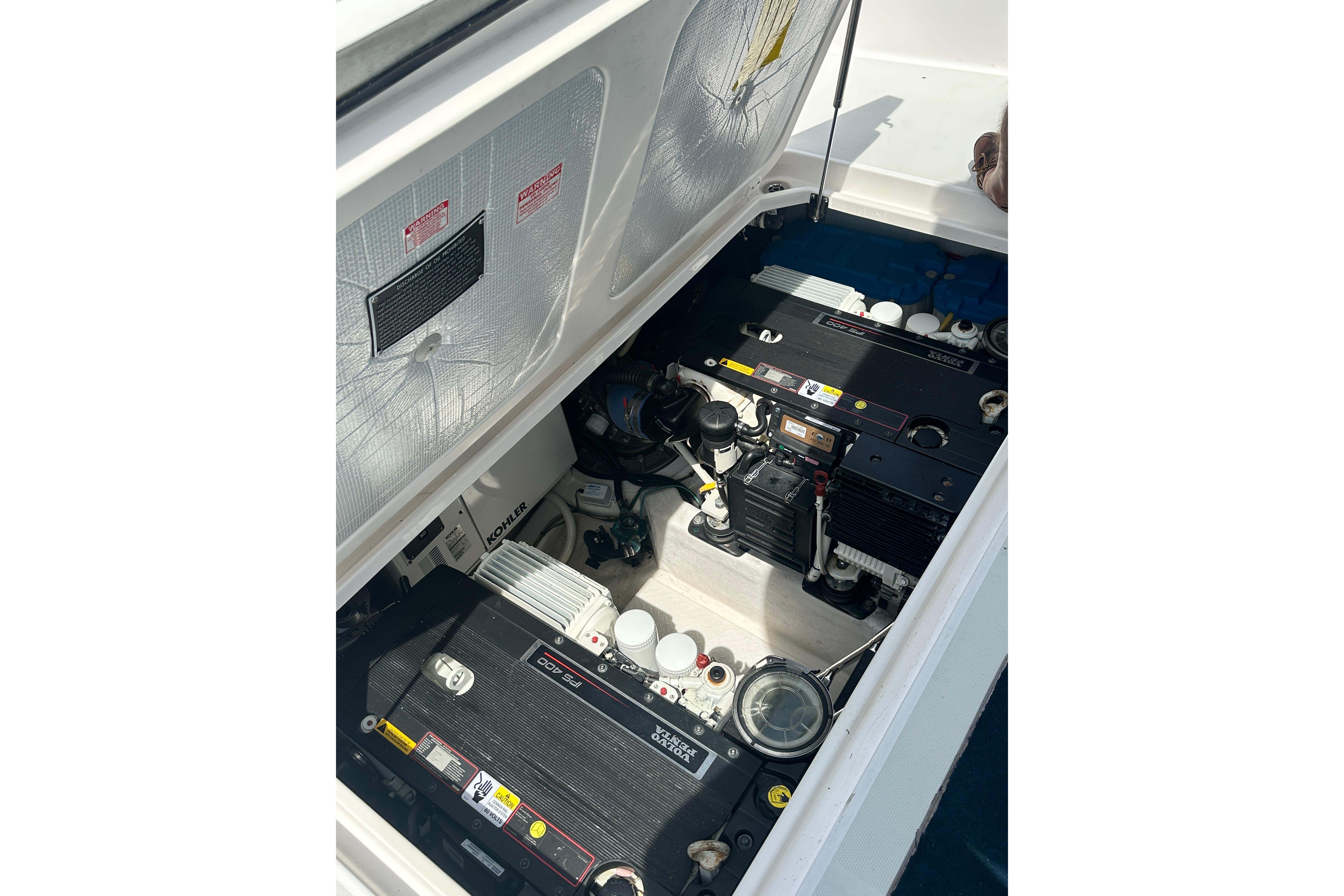 Engine compartment of 2013 Sabre 38 Salon Express, showcasing mechanical components.