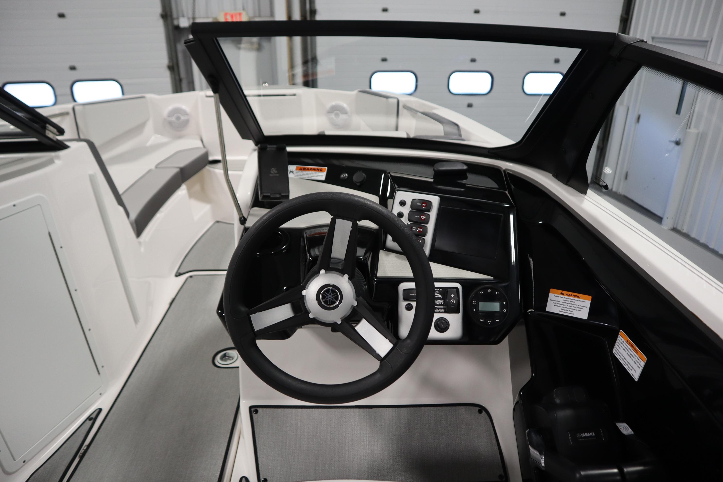 2026 Yamaha Boats AR220 cockpit with modern steering and control panel.
