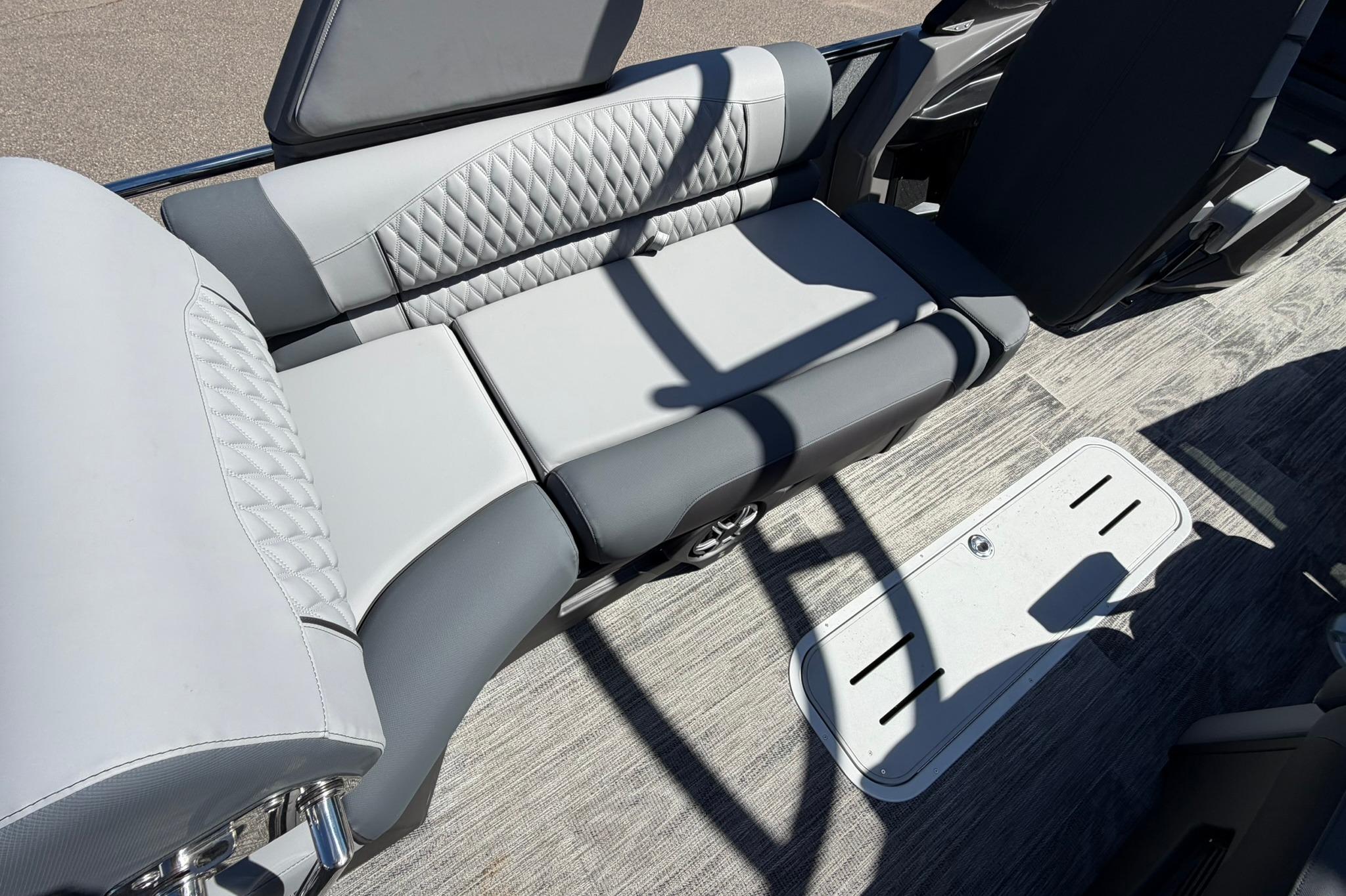 Luxurious seating on 2026 Avalon Excalibur LTD Quad Lounge boat, featuring elegant upholstery and modern design.