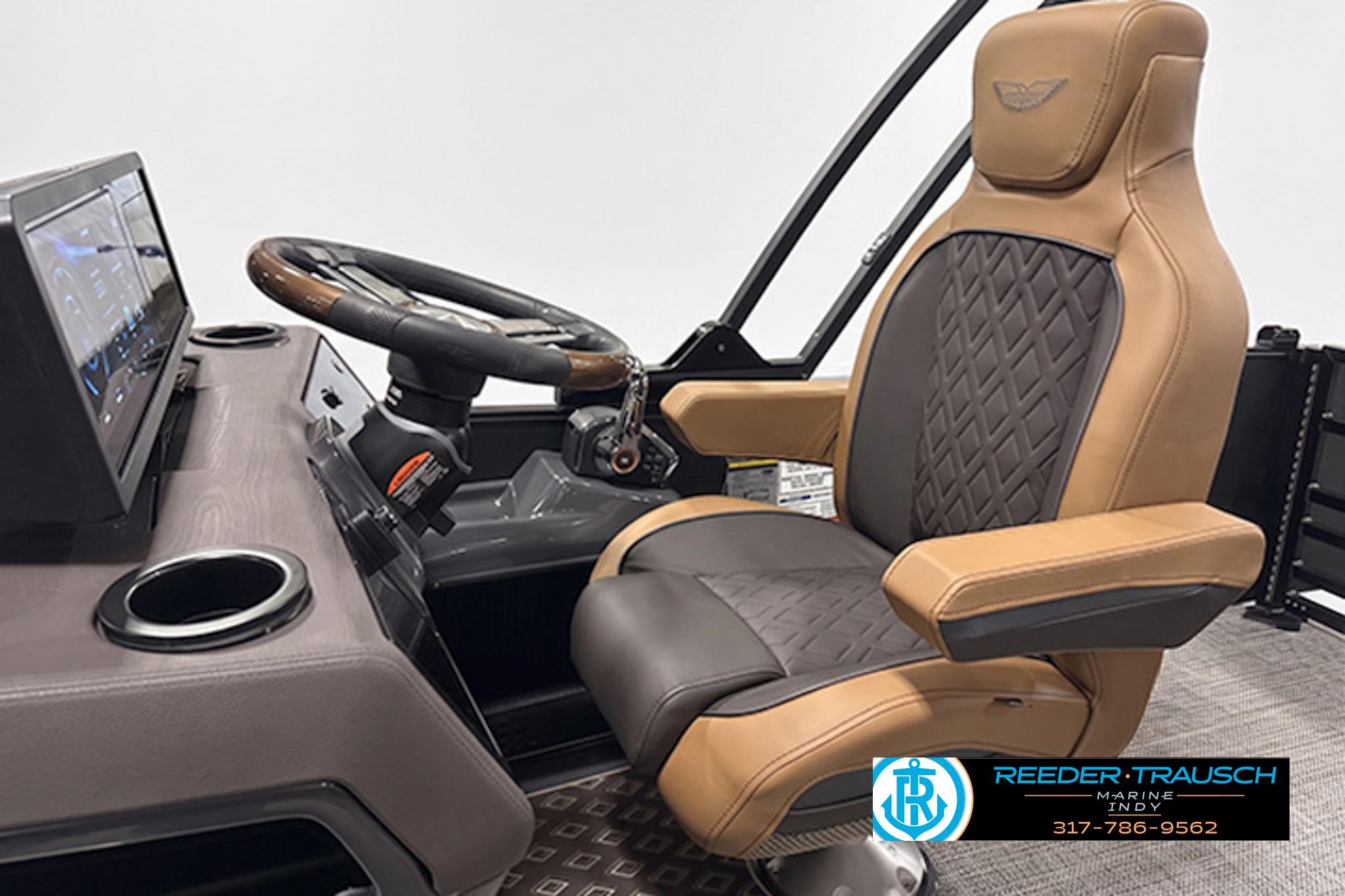 Captain's chair and helm of 2027 Bennington 24 MSB pontoon boat, featuring luxury design.