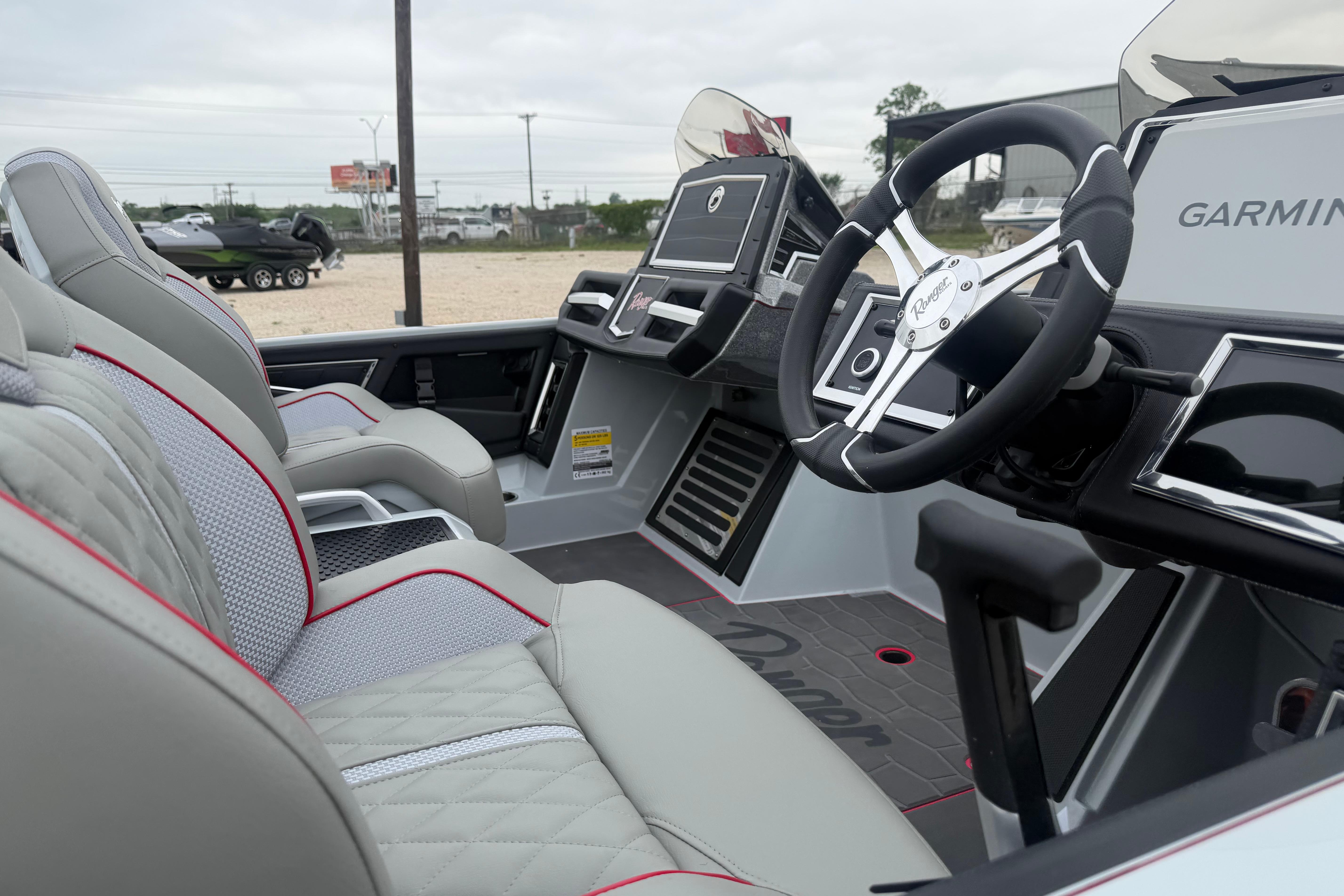 2026 Ranger Z521R Cup-Equipped boat interior with advanced Garmin navigation system.
