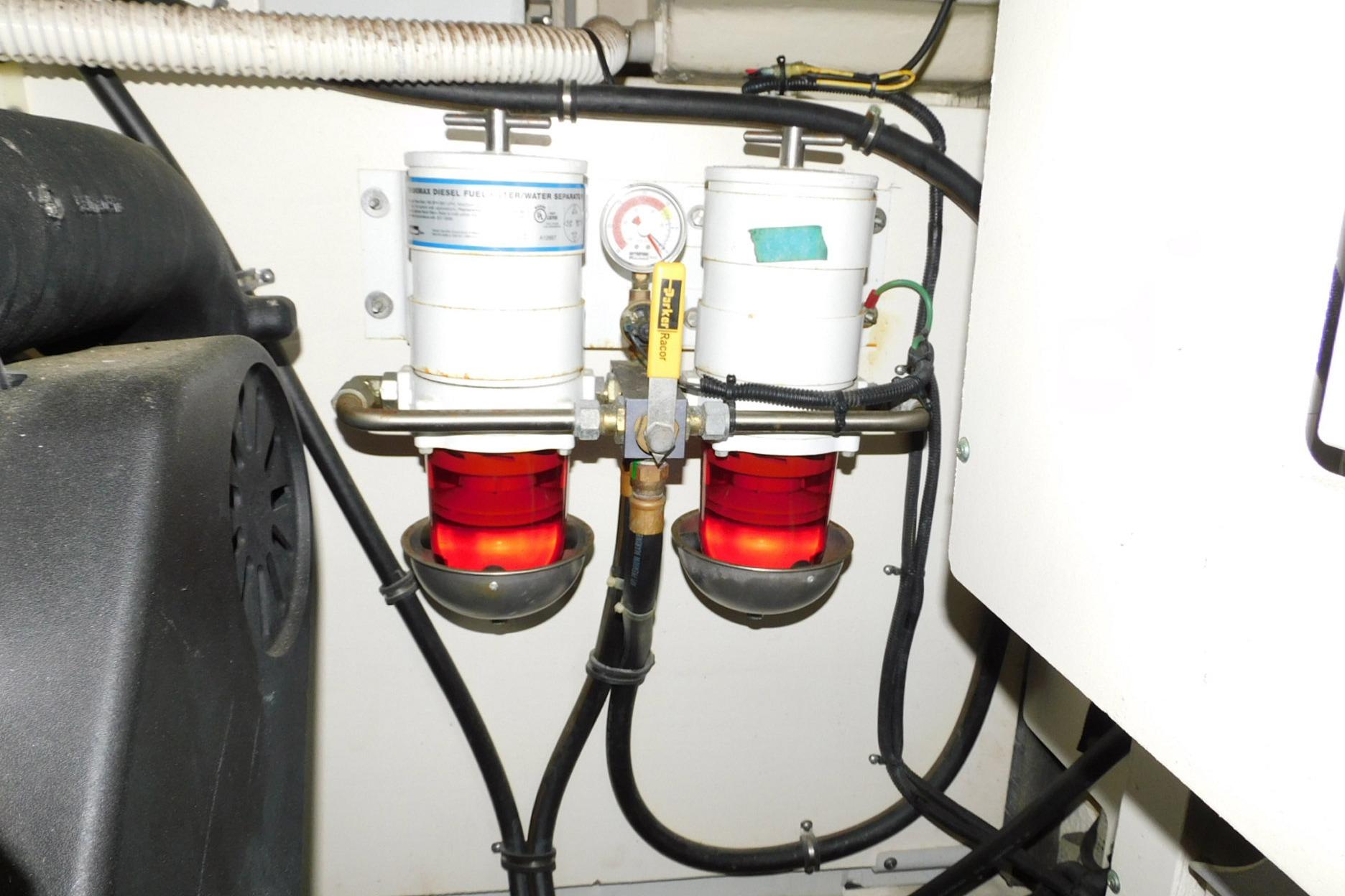 Engine room of 2019 Sea Ray L550 with dual fuel filters and gauge.