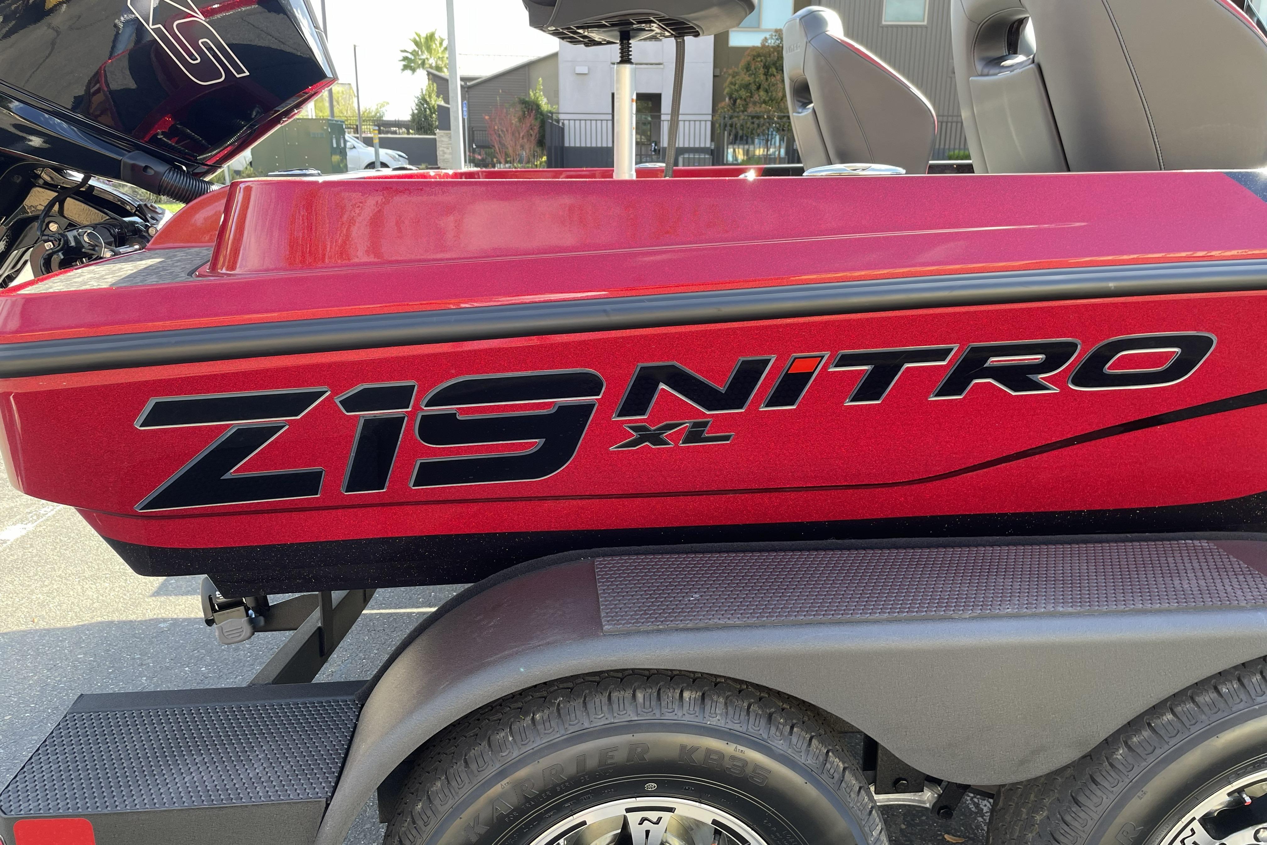 2026 Nitro Z19 XL boat, red exterior, parked on a trailer.