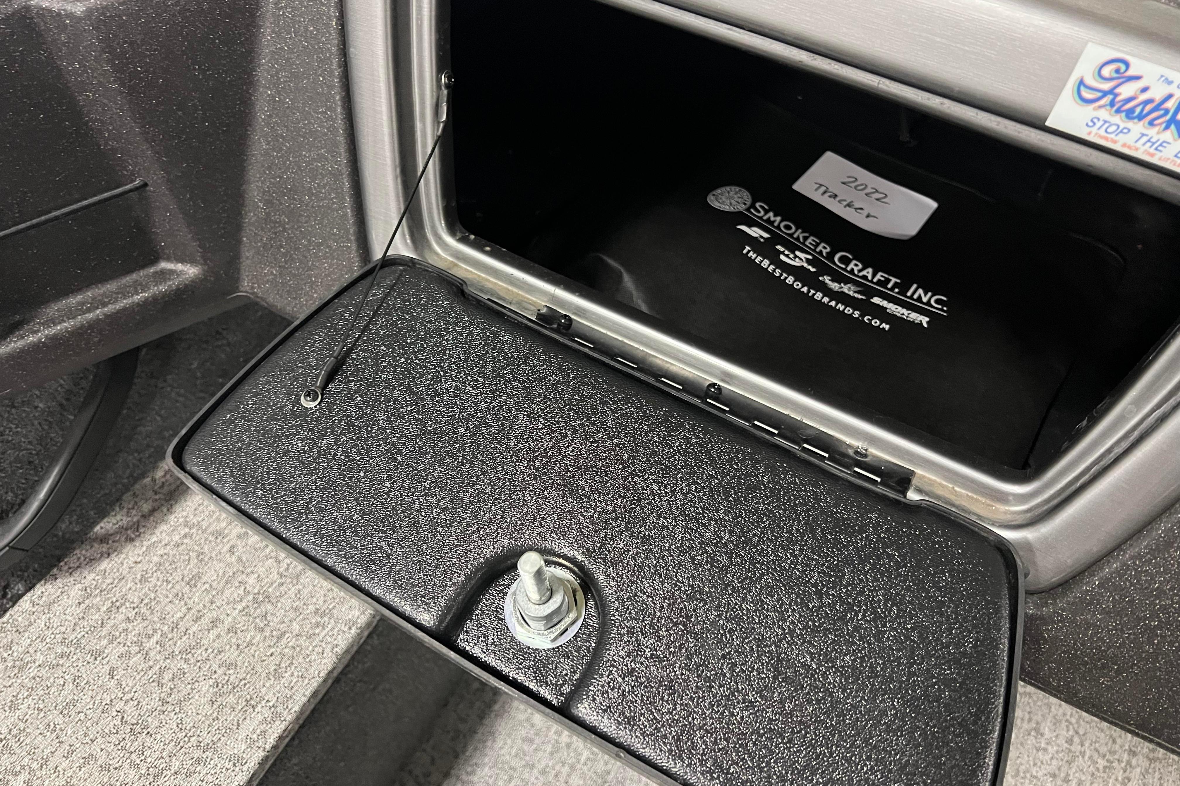 2022 Tracker Pro Guide V-16 WT boat compartment with Smoker Craft Inc. branding.
