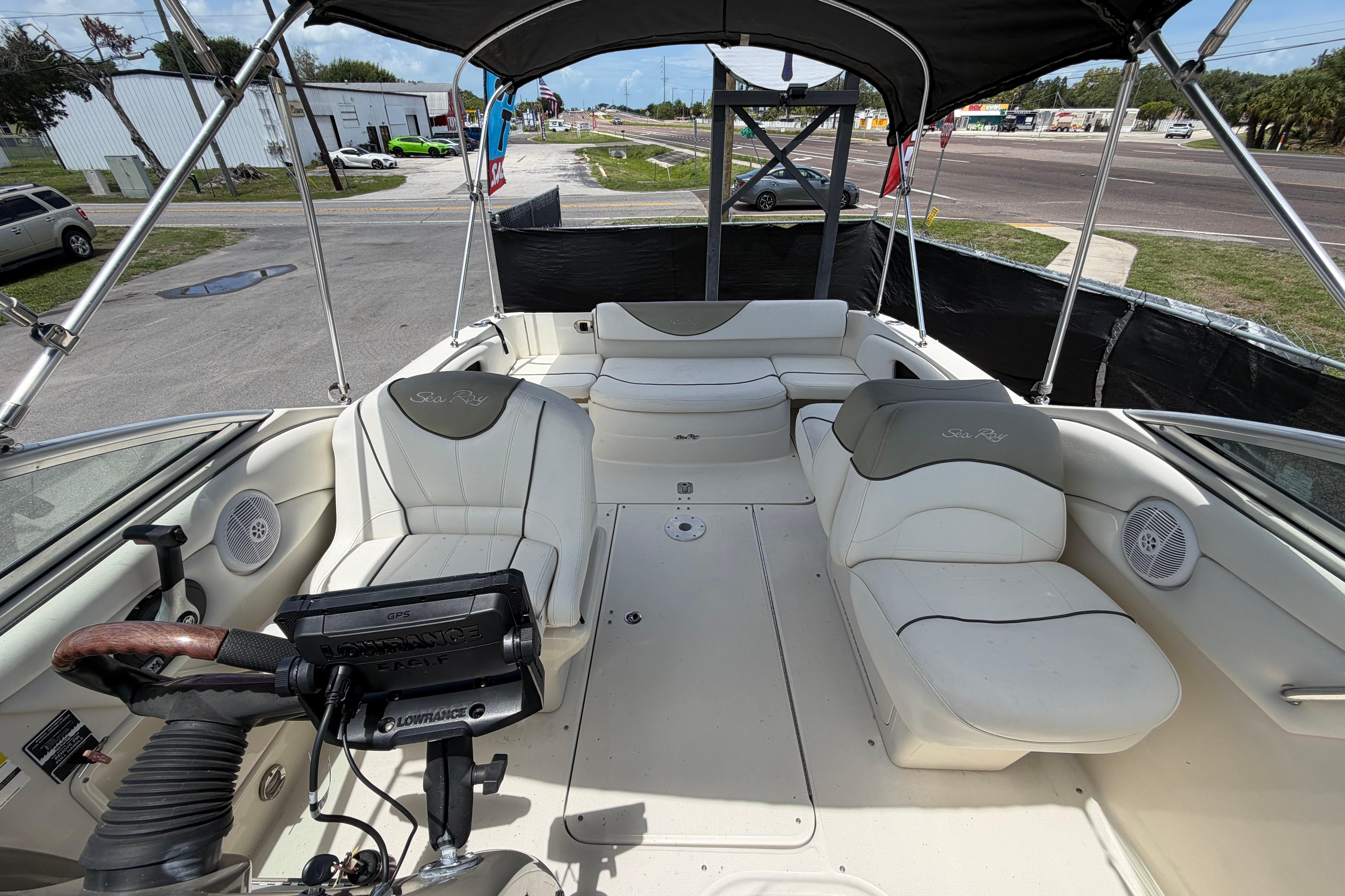 2006 Sea Ray 250 Amberjack boat interior with seating and steering wheel.