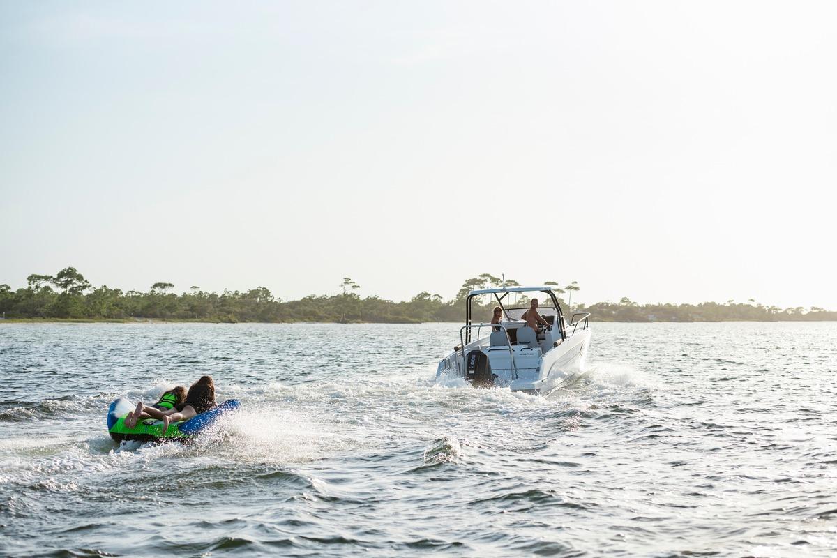 2026 Beneteau Flyer 8 SUNdeck towing inflatable on open water.