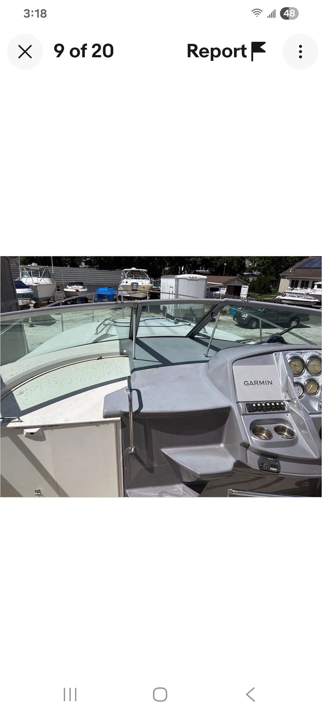 The image shows the cockpit of a Monterey 290 Cruiser boat with a helm and instruments.