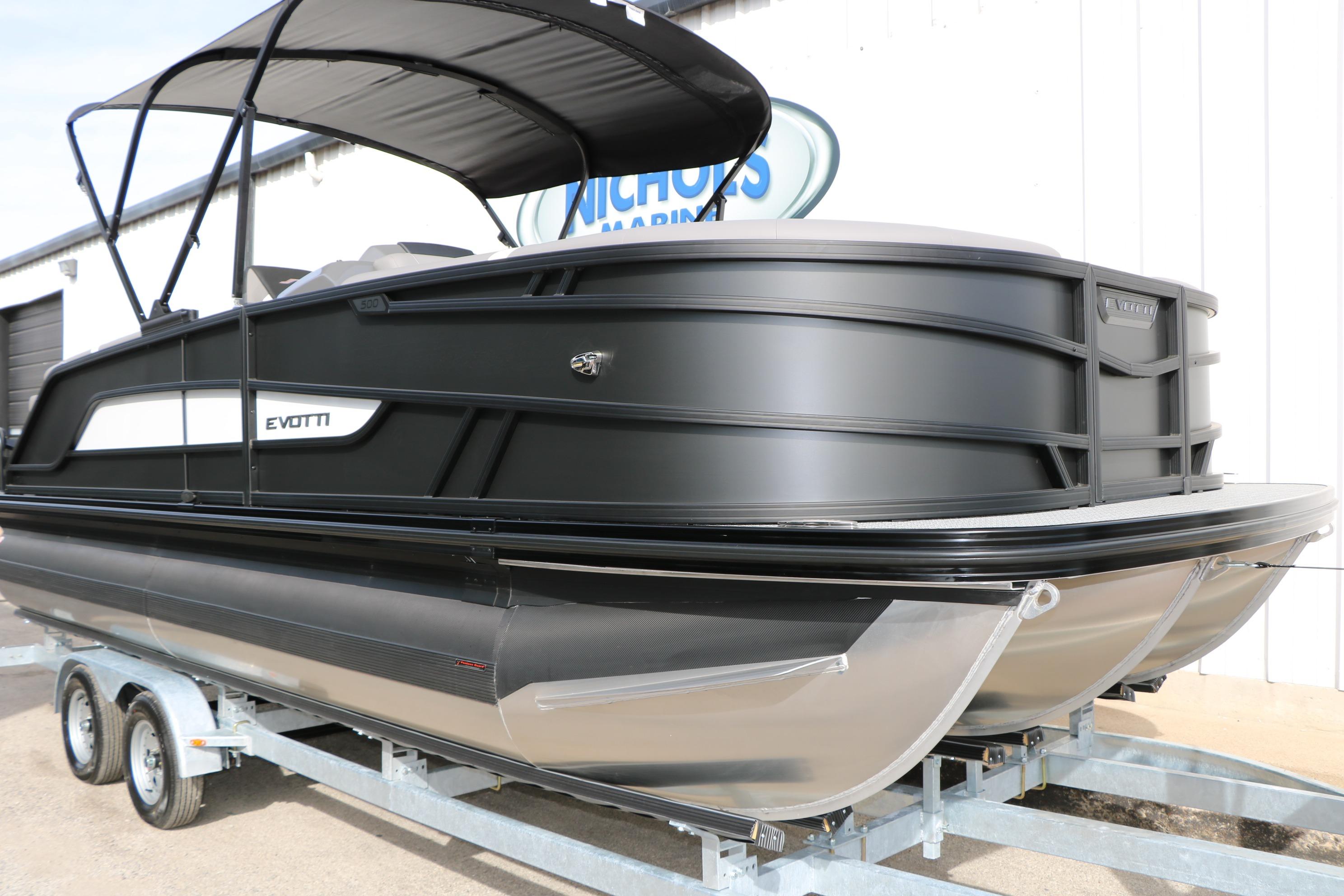 2026 Evotti 521QL pontoon boat on trailer, sleek black design, outdoor display.