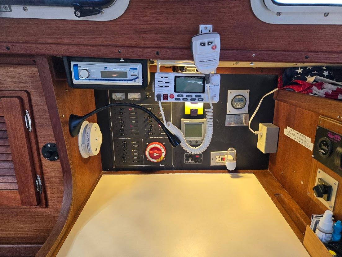 Control panel of a 1991 Freedom F-38 sailboat with navigation and communication equipment.