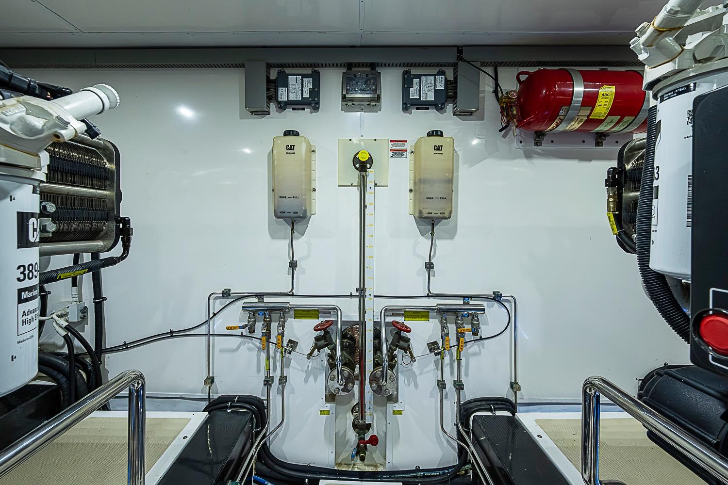 Engine room of 2014 Marlow 80 Explorer yacht with CAT machinery and fire suppression system.