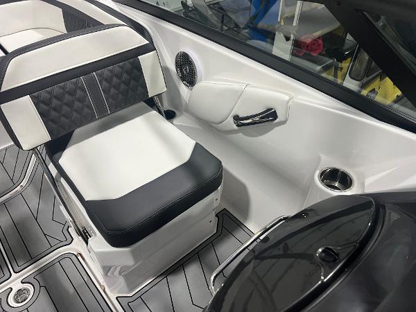 2024 Monterey M4 boat interior with black and white seating, speaker, and cup holder.