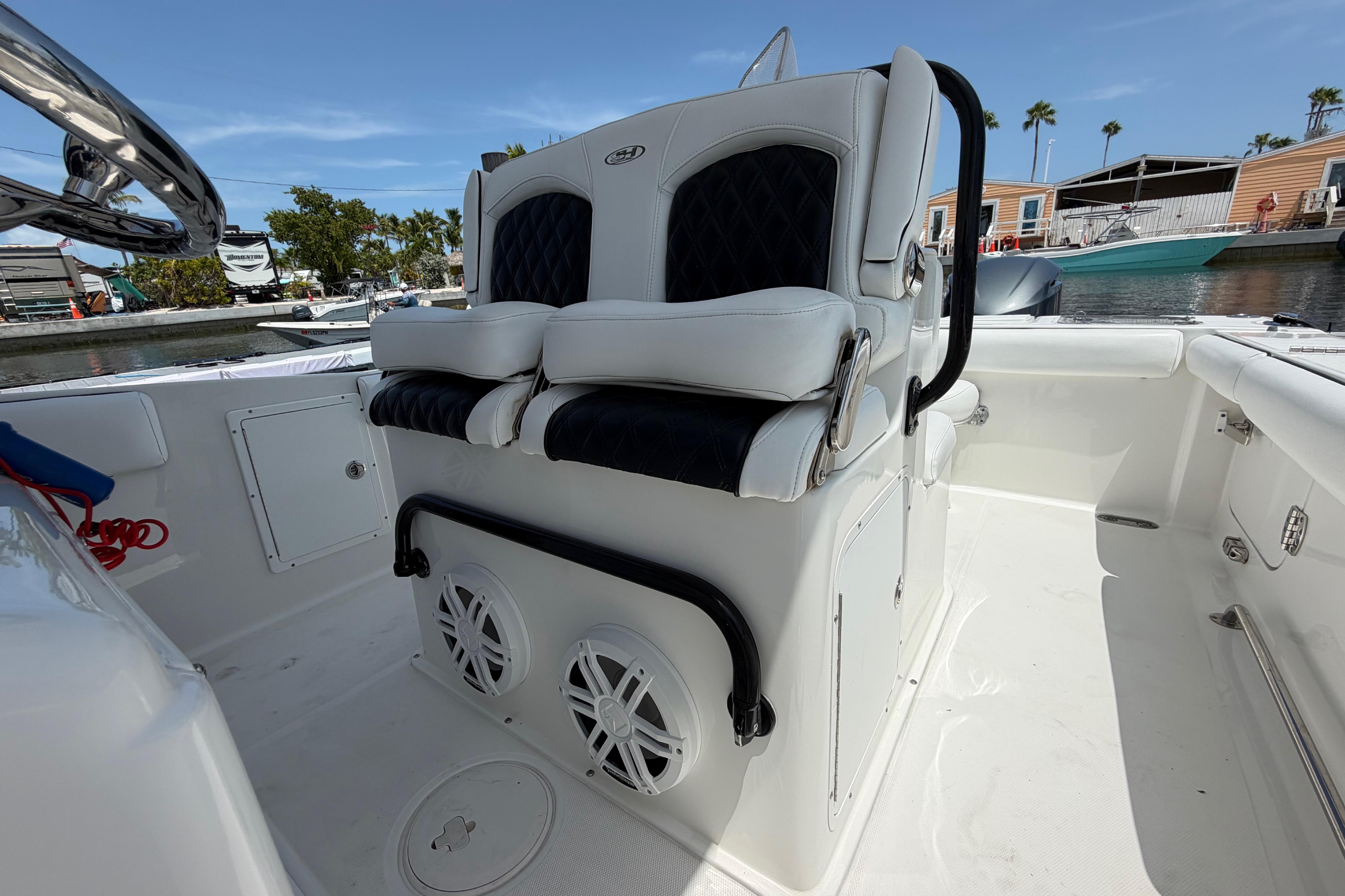 2019 Sea Hunt Gamefish 27 Coffin Box boat interior with cushioned seating and speakers.