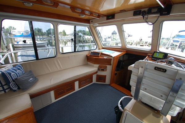Interior of a 2005 Fox Island Thirty - Sedan Cruiser with comfortable seating and helm station.