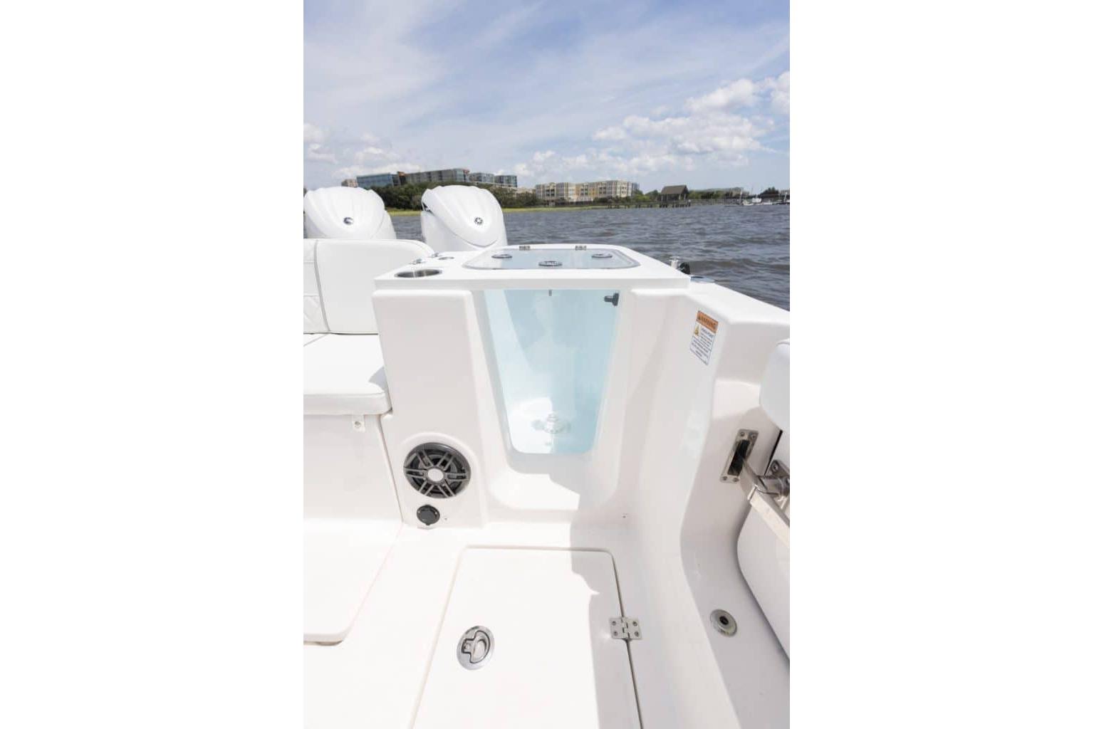 2027 Sea Fox 268 Commander boat interior with water view and modern features.