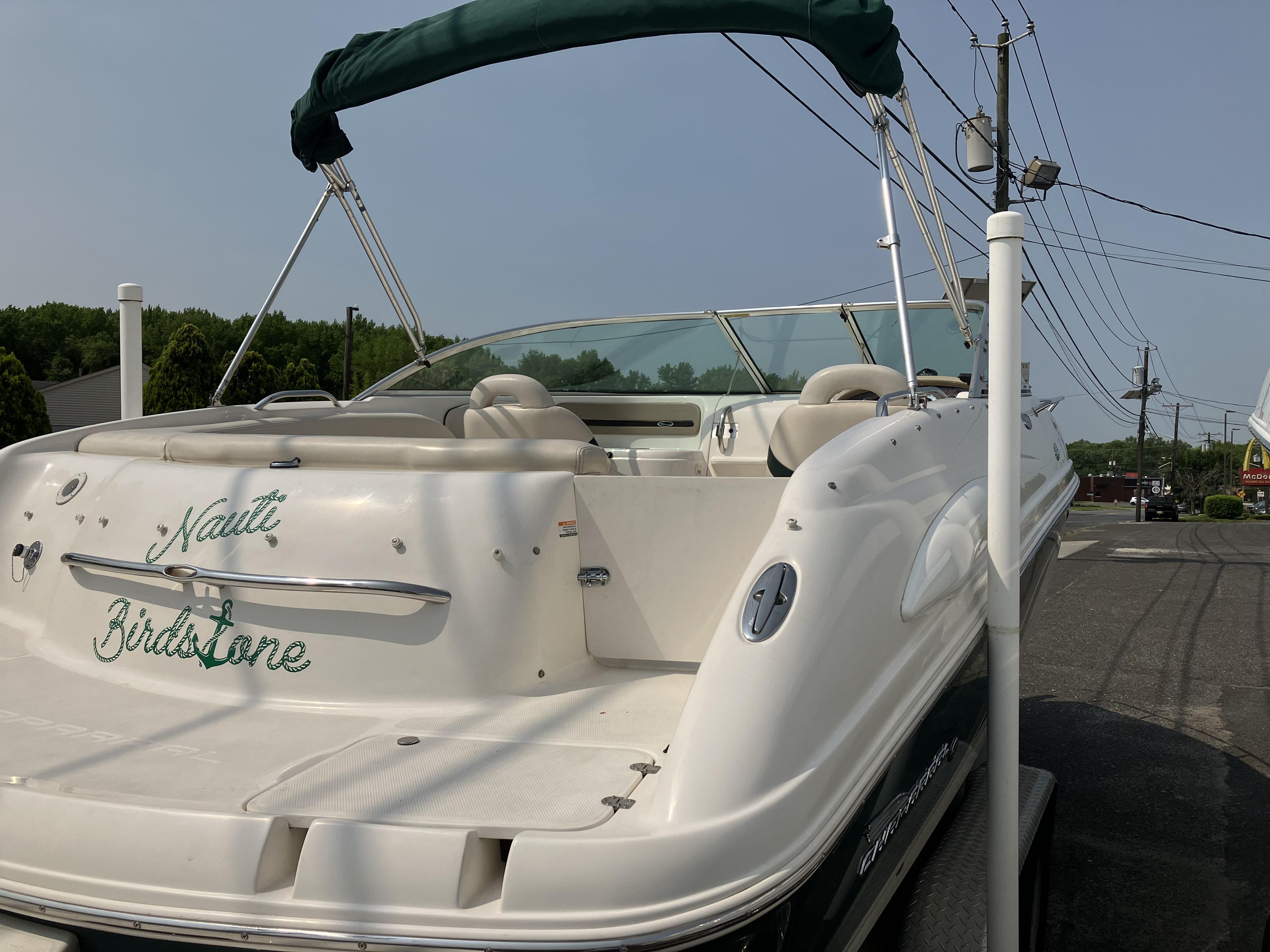 A 2001 Chaparral 235 SSi boat on a trailer, ready for the water.