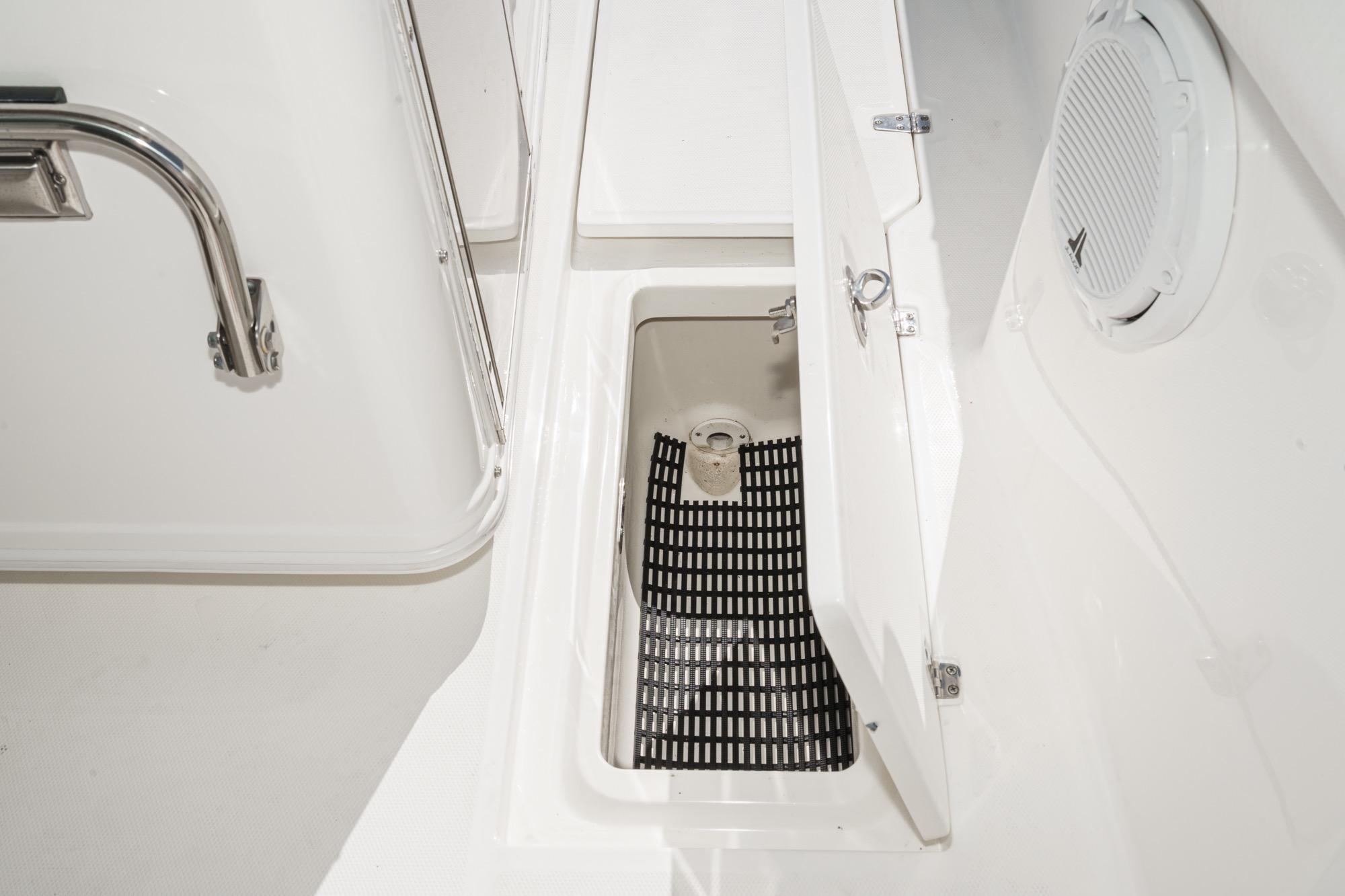 Open storage compartment on 2015 Boston Whaler 370 Outrage boat deck.