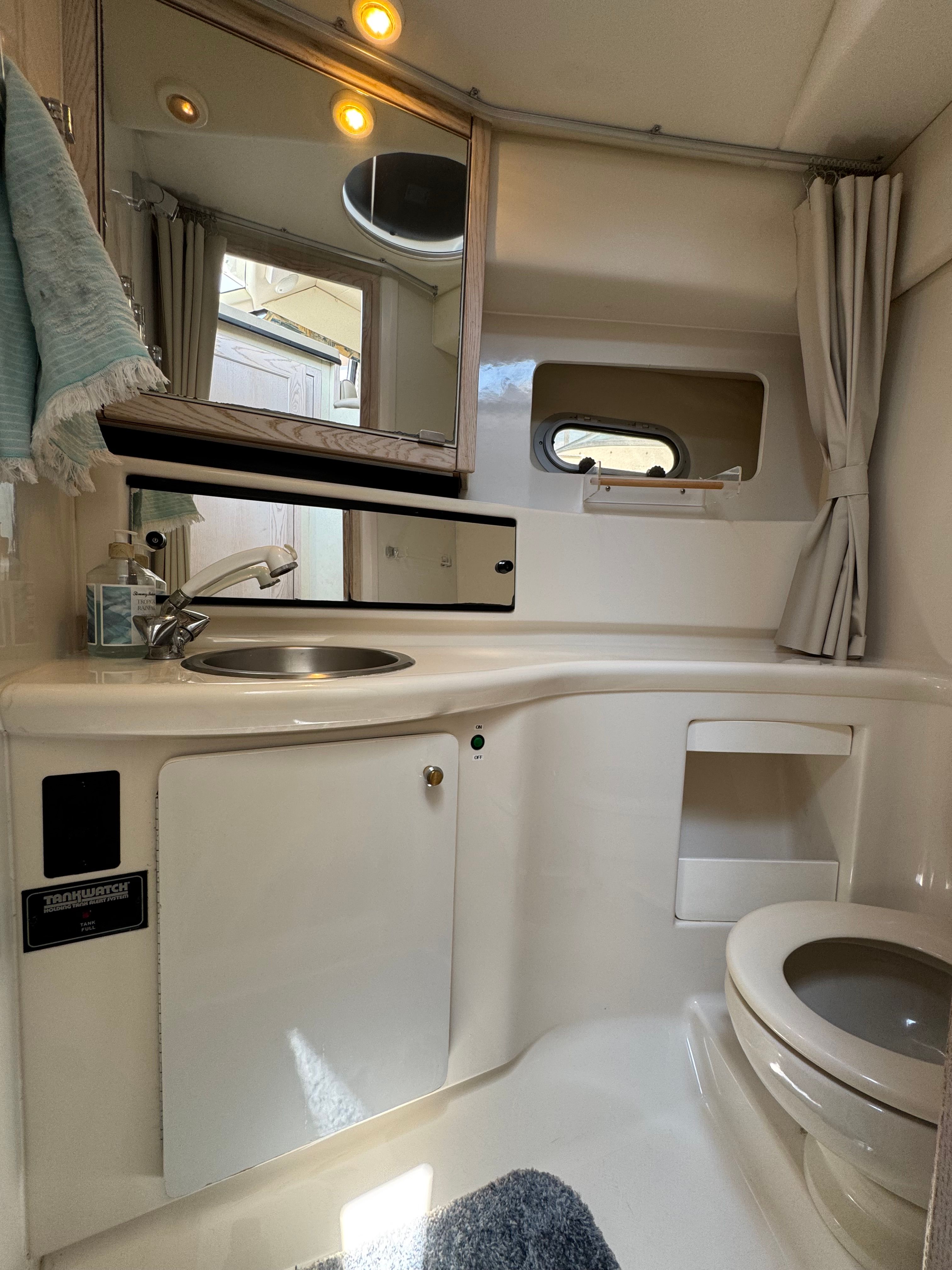 Bayliner 3587 yacht bathroom, 1996, featuring sink and toilet.