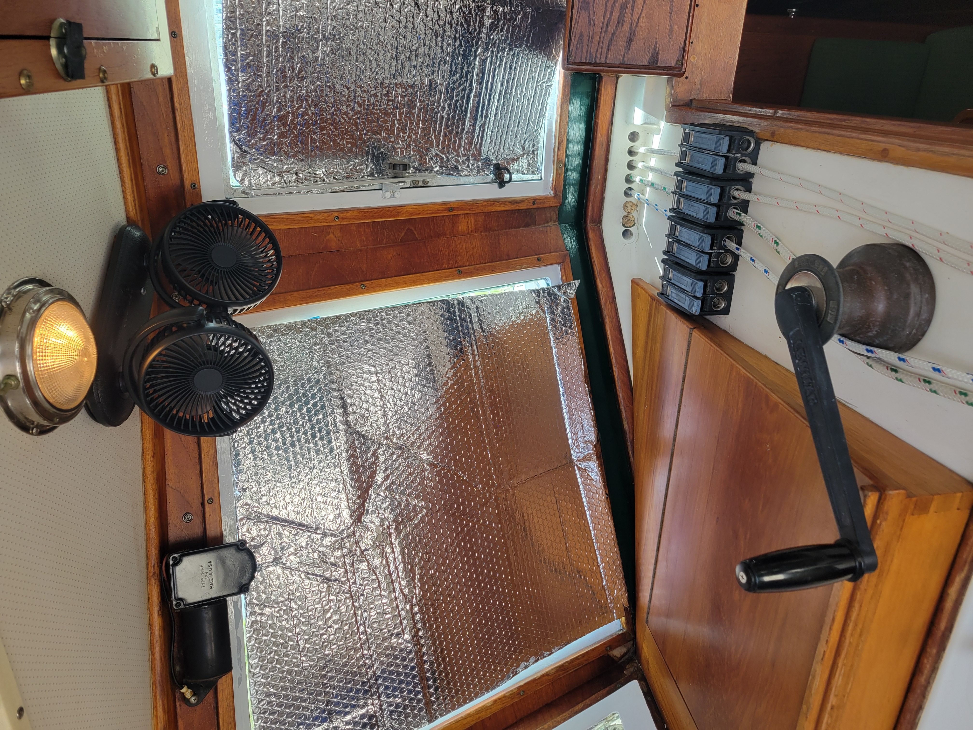 Interior of a 1989 Cape Dory MS300 with fans and a control lever.