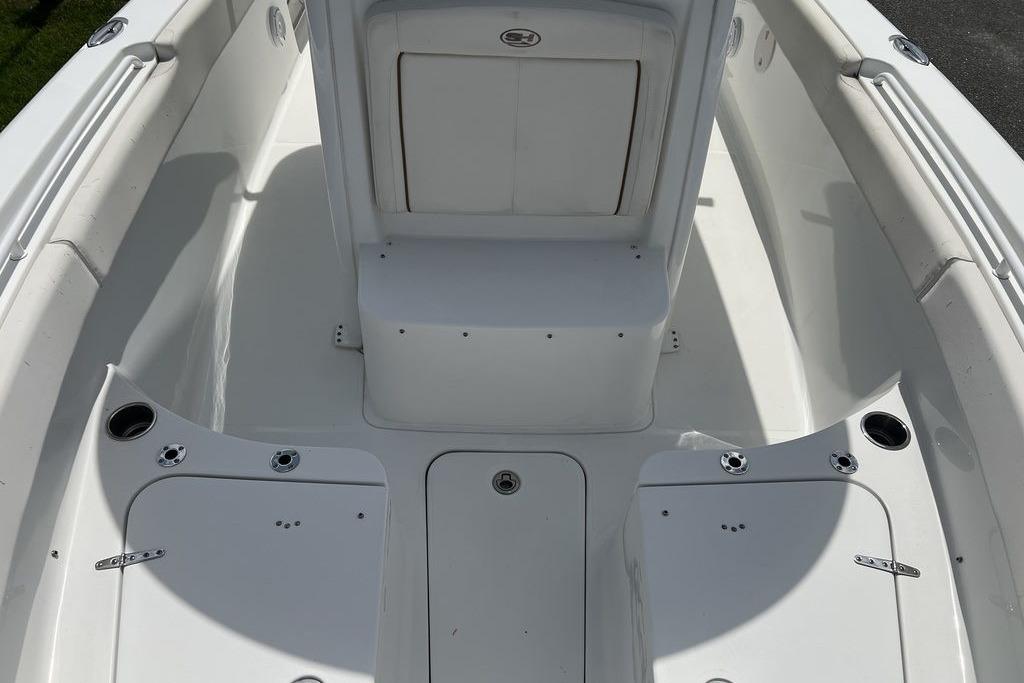 2021 Sea Hunt Gamefish 25 boat interior, featuring spacious seating and storage compartments.
