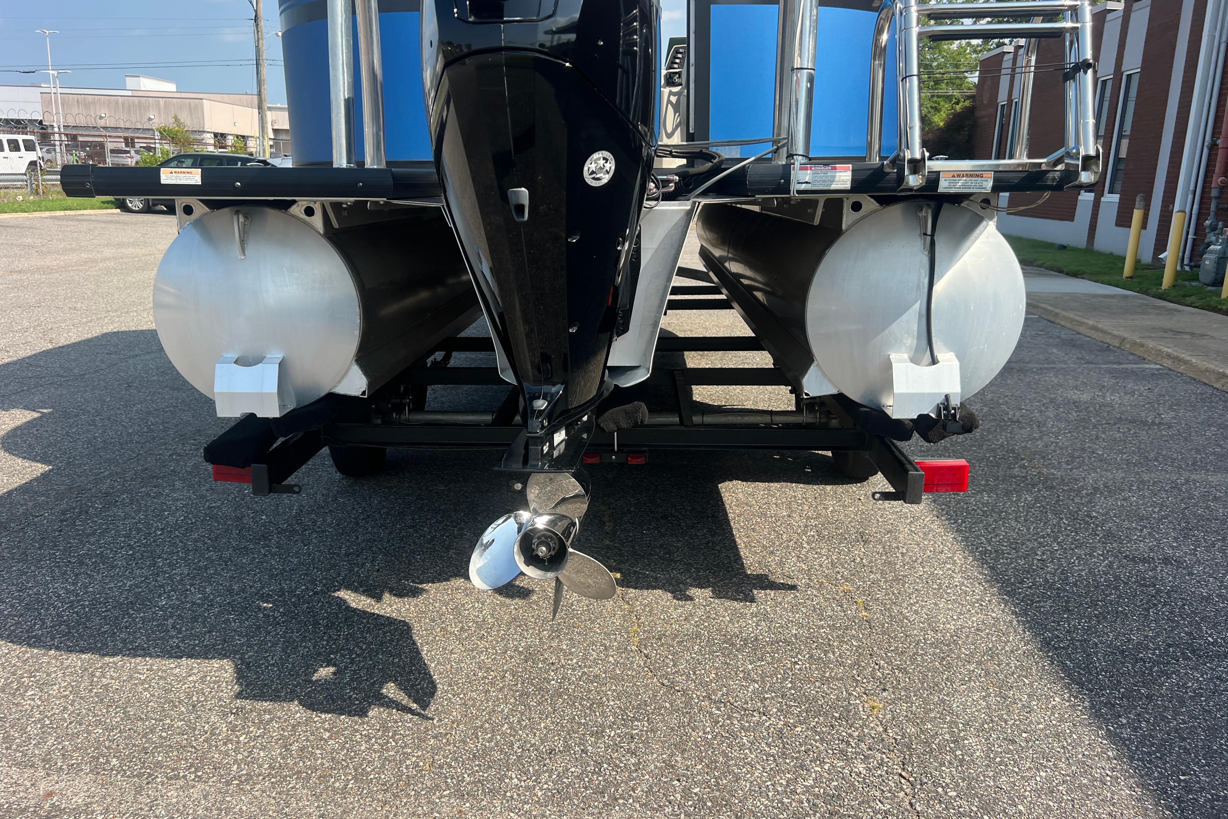 Rear view of 2022 Viaggio Lago V-U 22 pontoon boat on trailer, showcasing dual pontoons.