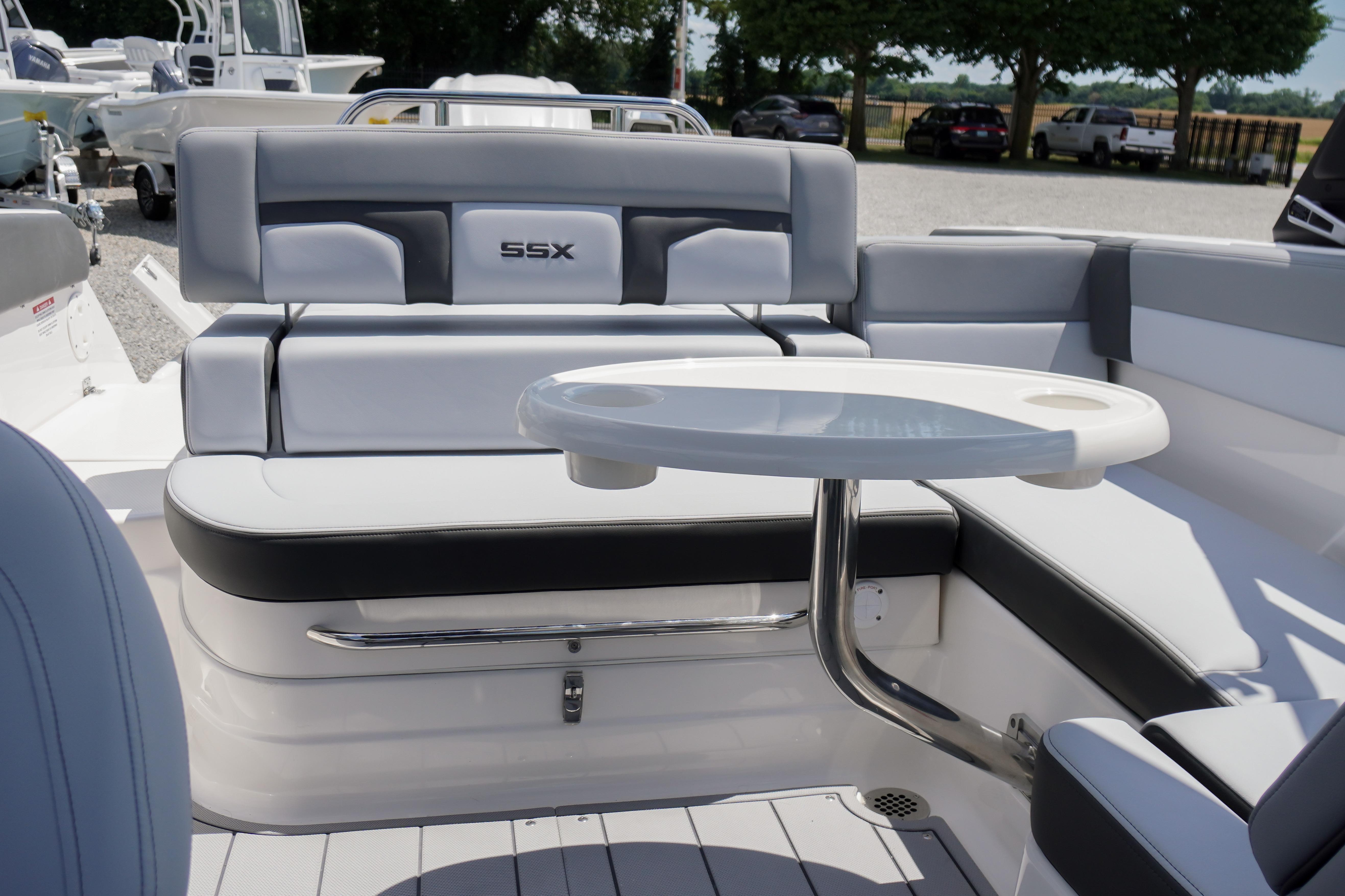 2026 Chaparral SSX 4 boat interior with seating and table, showcasing luxury design.